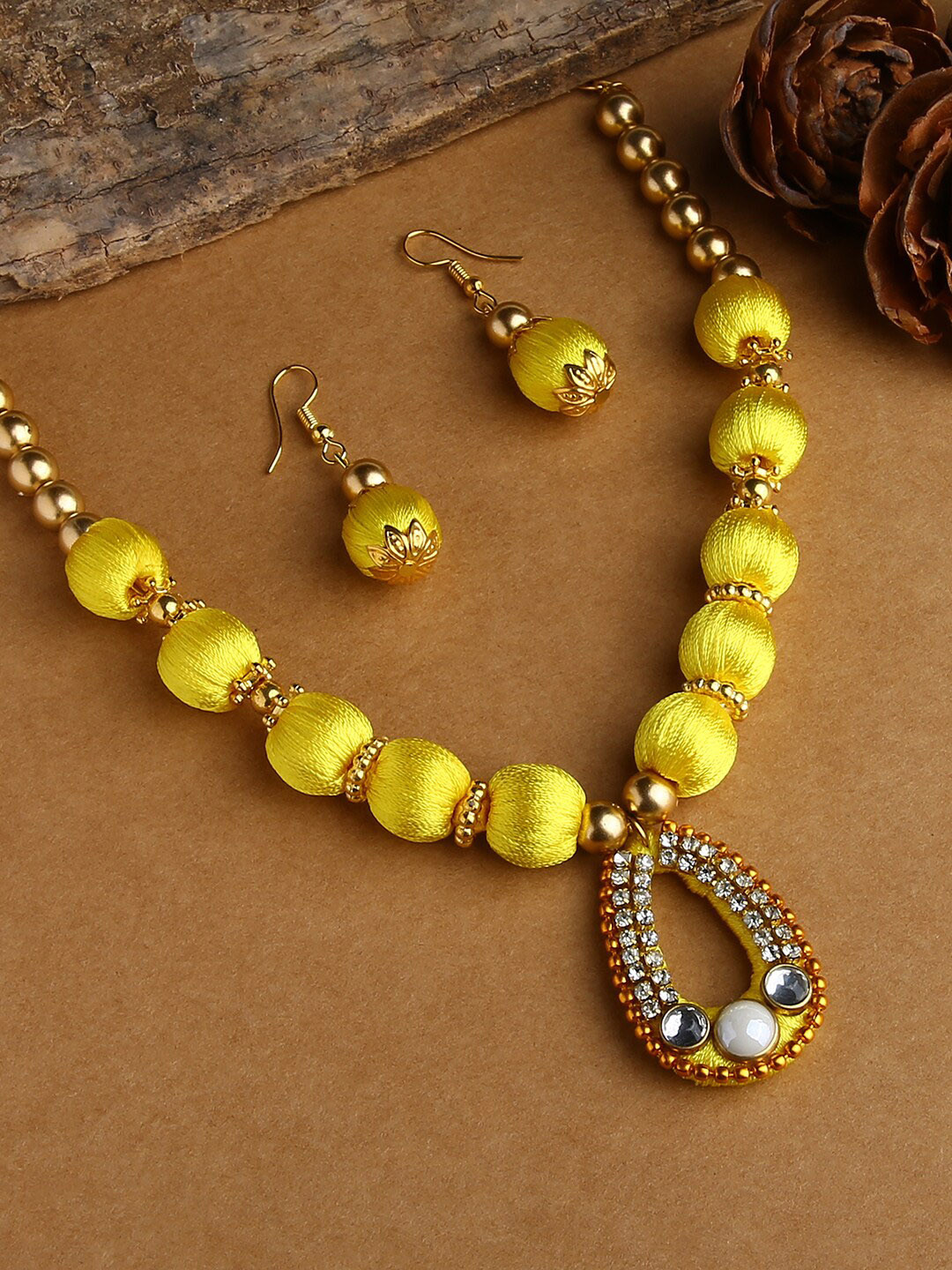 AKSHARA Gold-Plated Yellow & White Stone-Studded & Beaded Jewellery Set