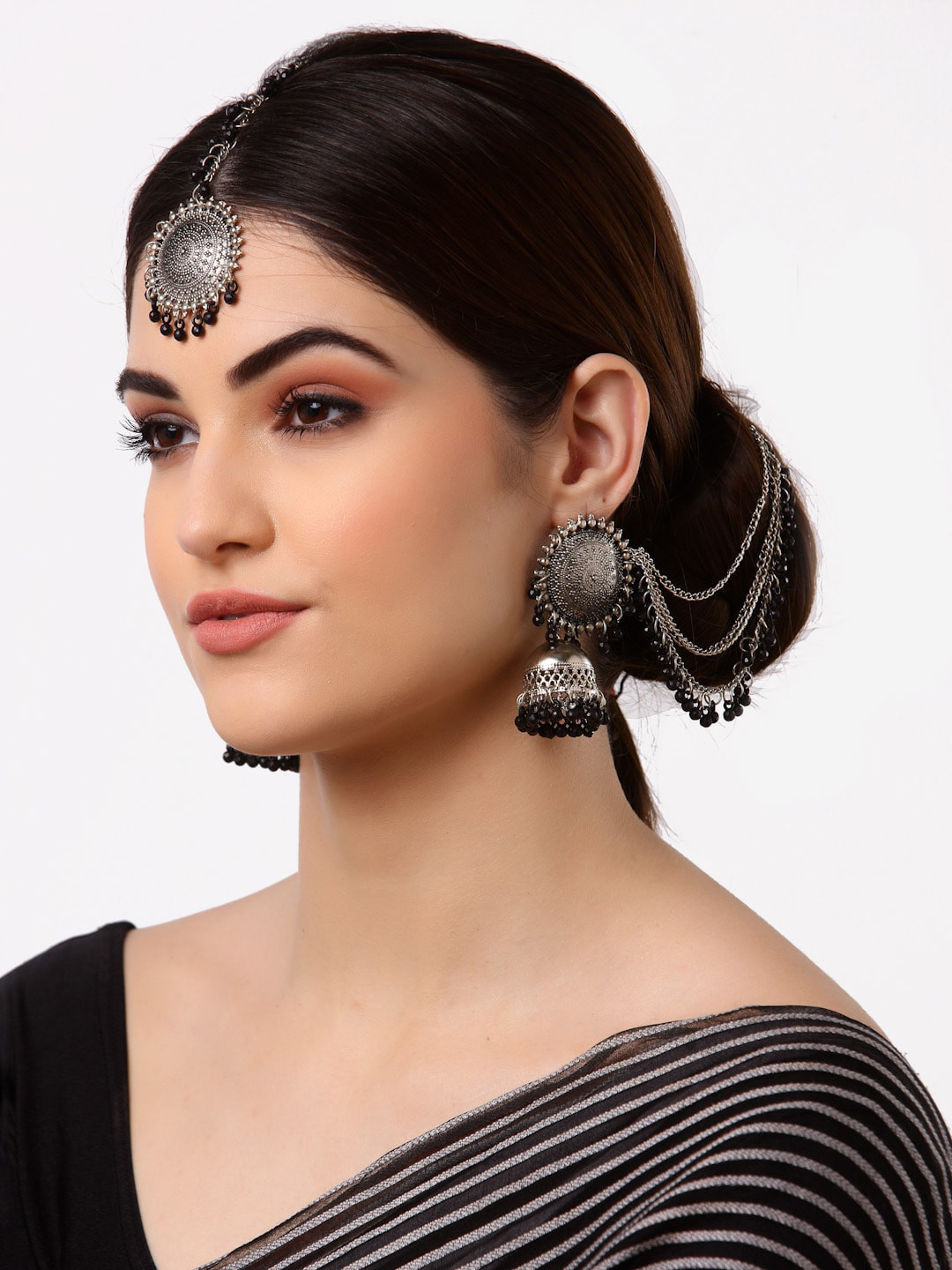 Arrabi Metallic & Black Oxidised Kundan Studded Maang Tika & Earrings Jewelry Set