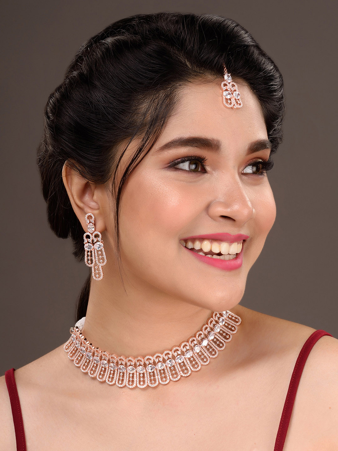 Saraf RS Jewellery Rose Gold-Plated White AD Studded Jewellery Set With Maang Tika