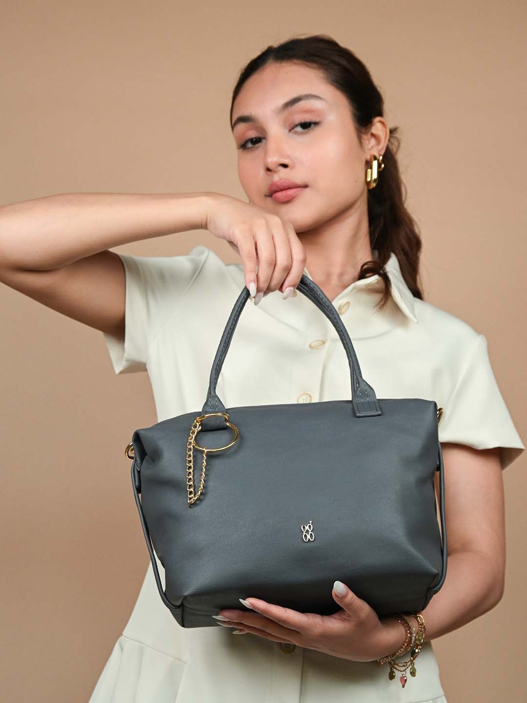 Buy Baggit Vintage Blue Solid Regular Structured Handheld Bag With Tasselled Detail Handbags for Women 16677108 Myntra