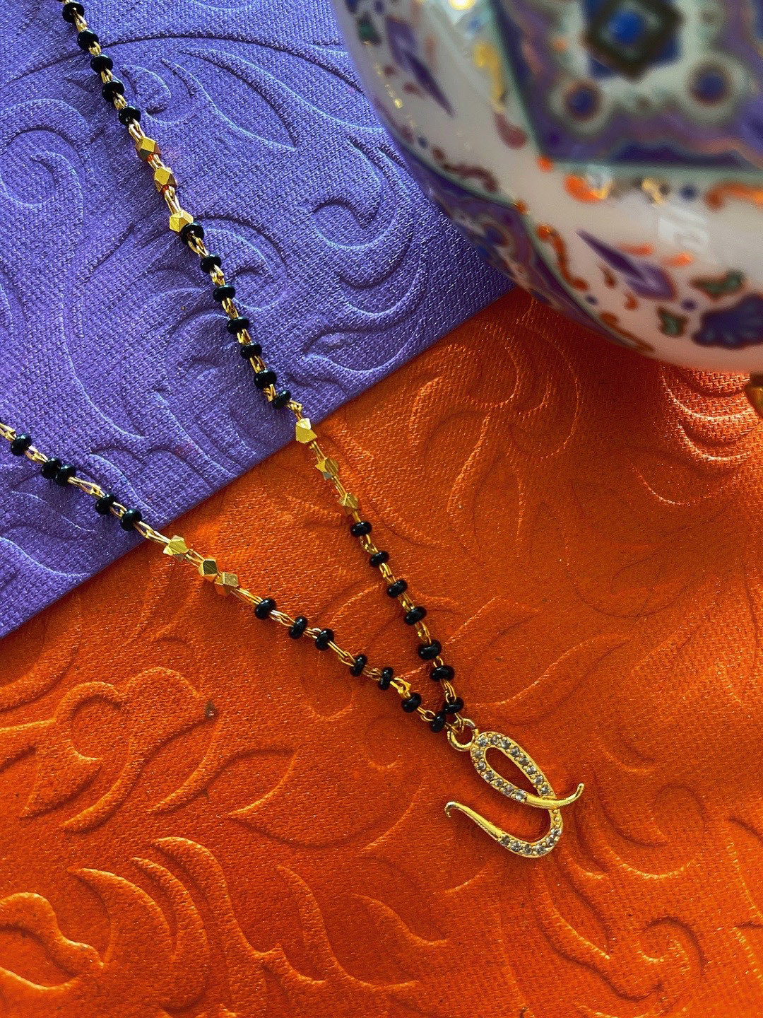 Digital Dress Room Gold -Plated U Letter Stone Studded & Black Beaded Mangalsutra
