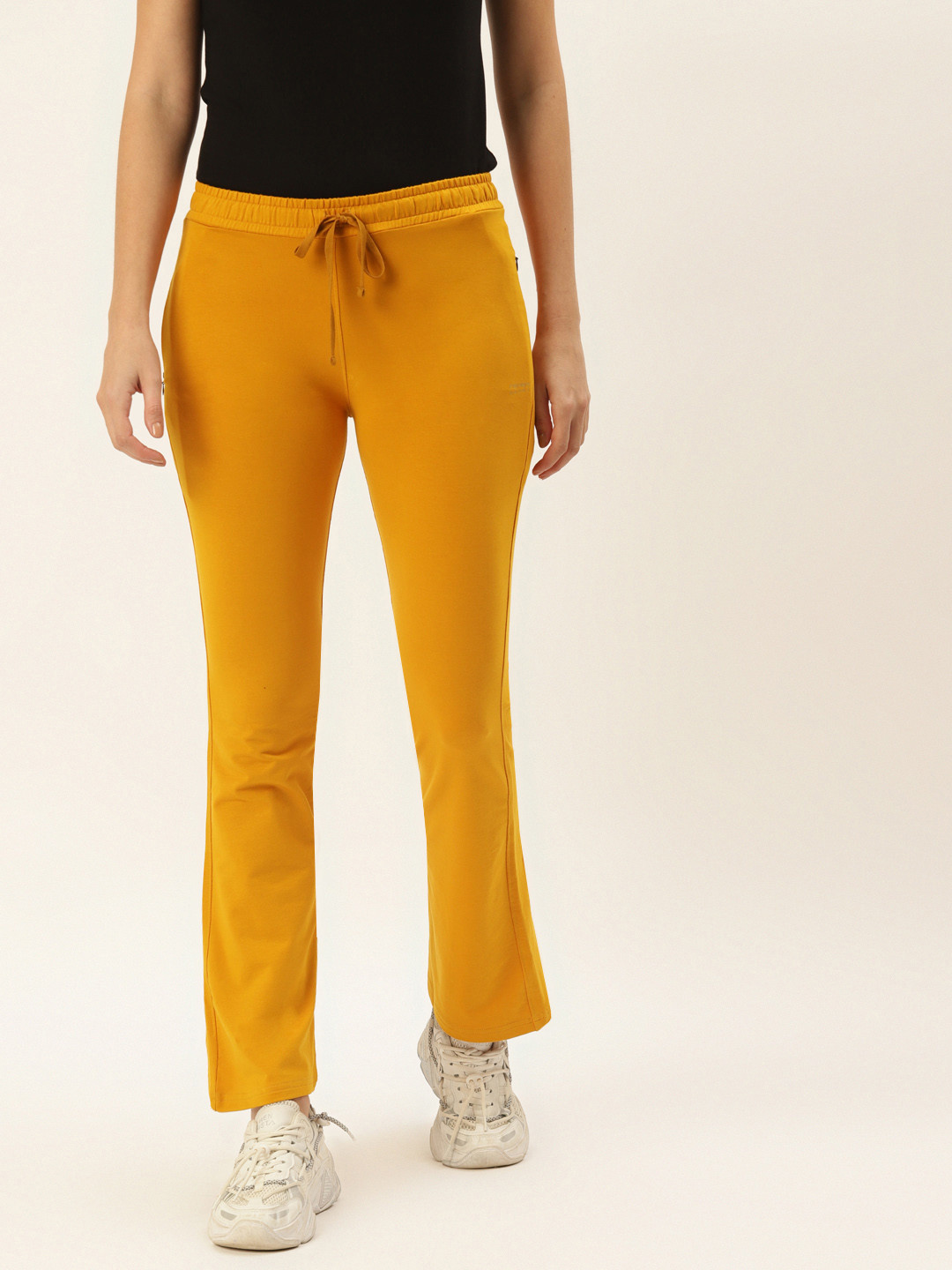 FEMEA Women Mustard Solid Bootcut Fit Track Pants