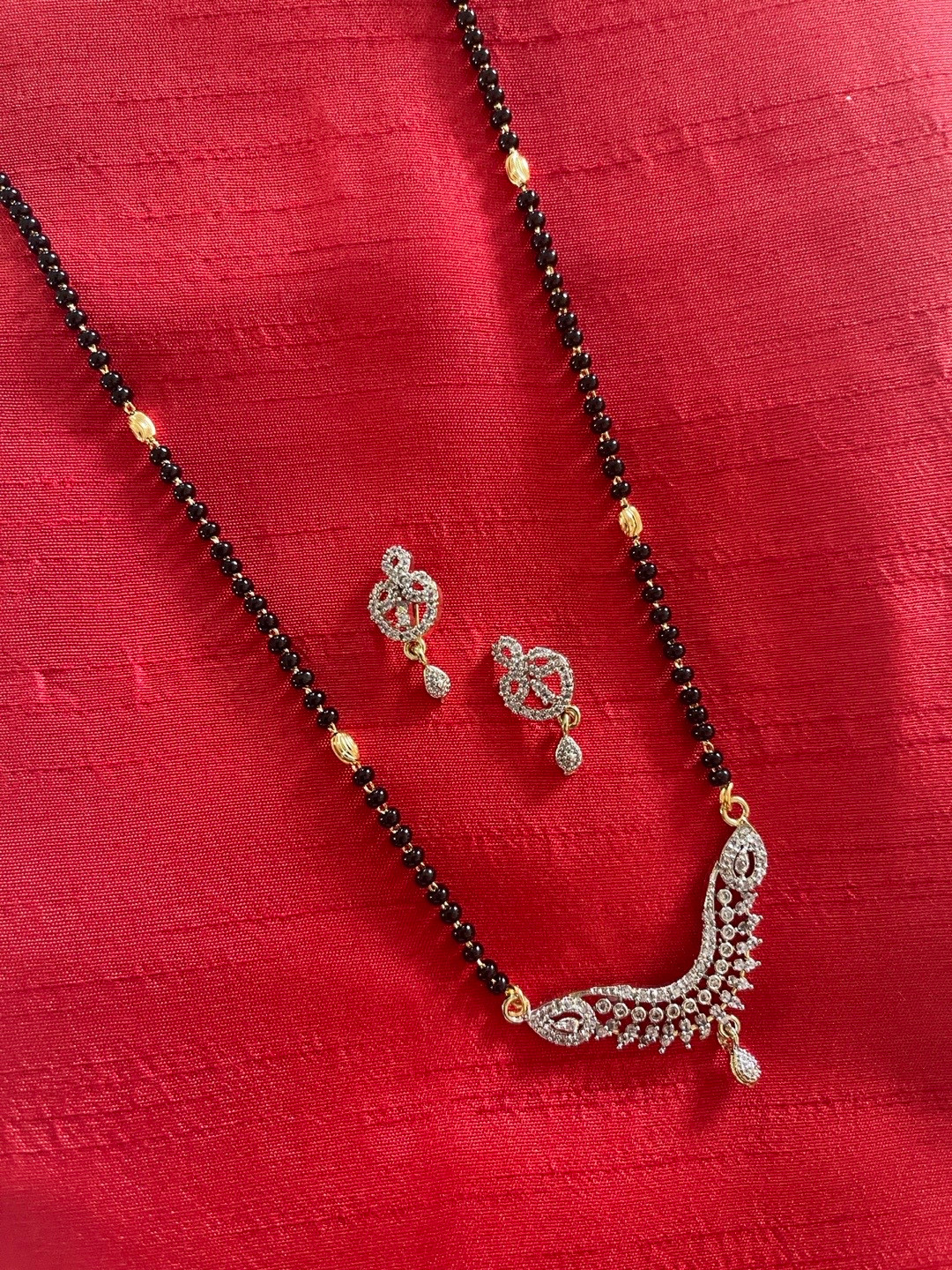 Digital Dress Room Gold-Plated & White AD-Studded & Beaded Long Mangalsutra With Earrings