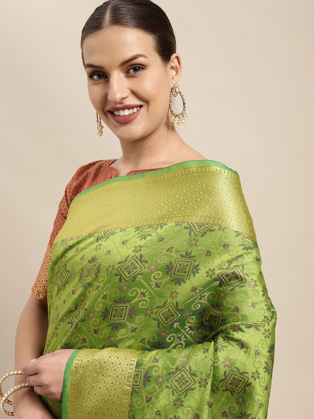 Mitera Green & Golden Ethnic Motifs Zari Silk Blend Patola Saree