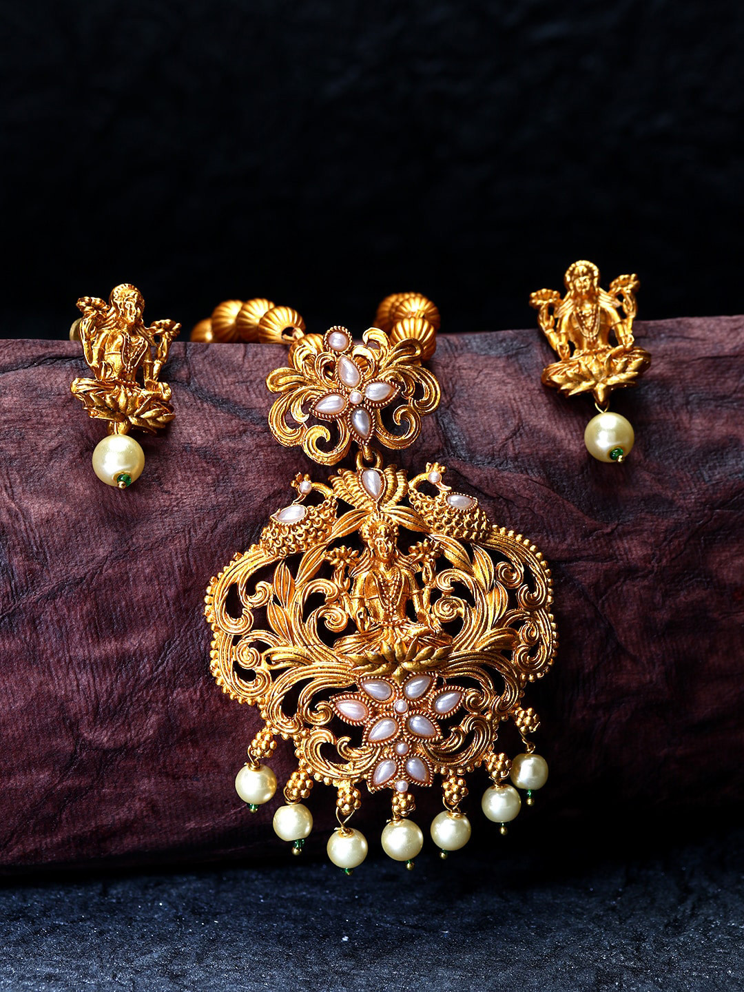 ANIKAS CREATION Women Gold-Plated Stone Studded & Pearl Temple Jewellery Set