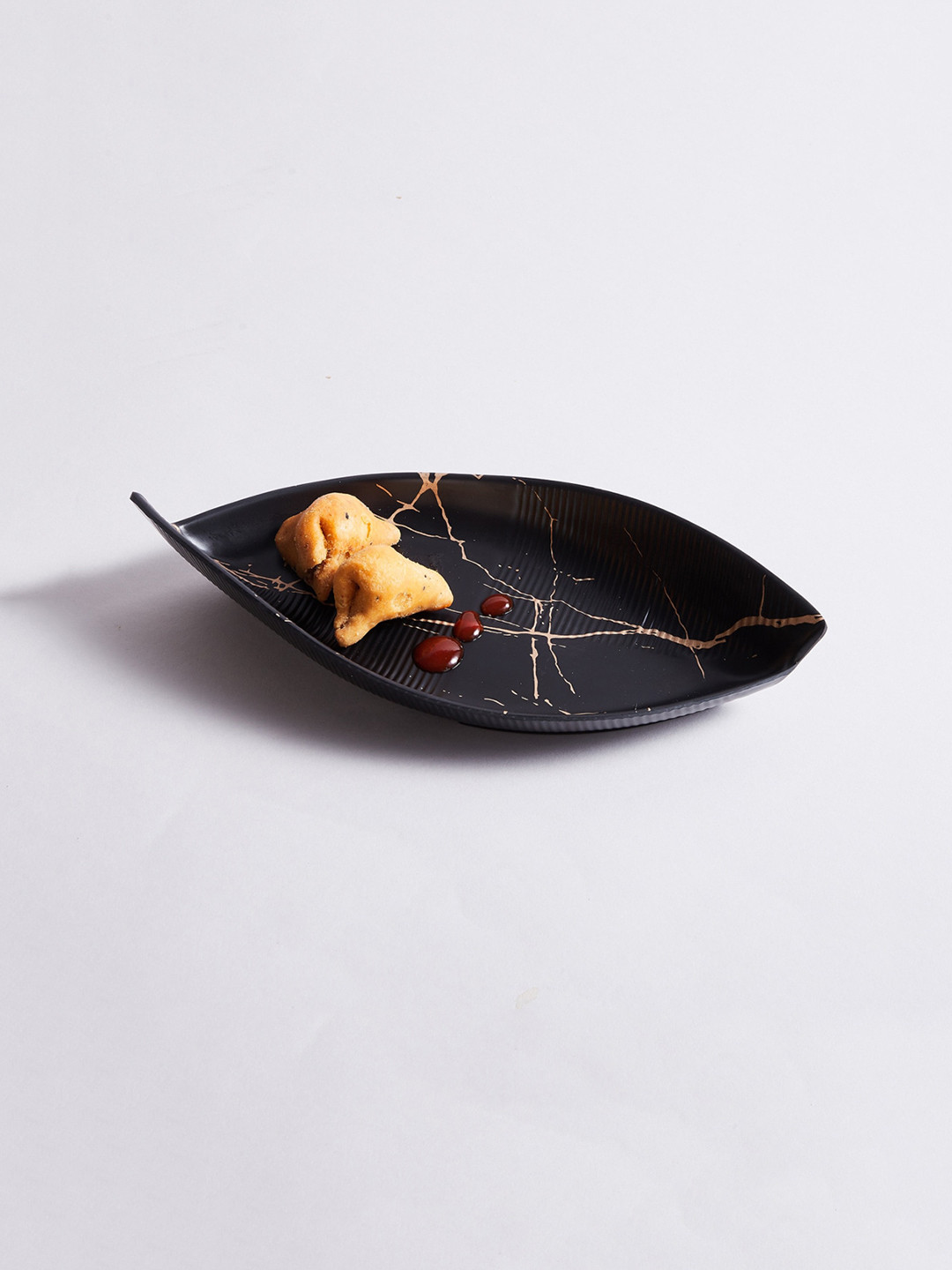 Home Centre Black & Gold-Toned Printed Melamine Leaf Serving Platter