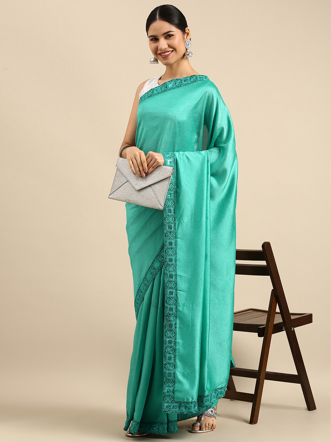 Anouk Women Green Solid Saree with Embroidered Border