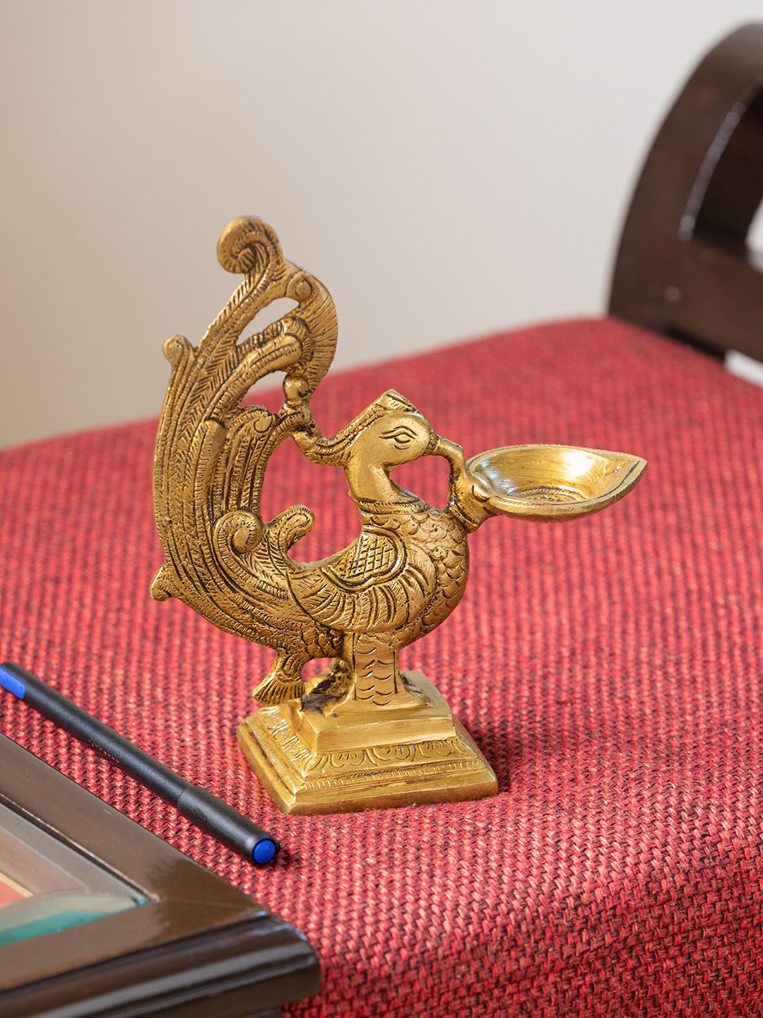 ExclusiveLane Gold Toned Marvellous Peacock Hand-Etched Carved Brass Diya
