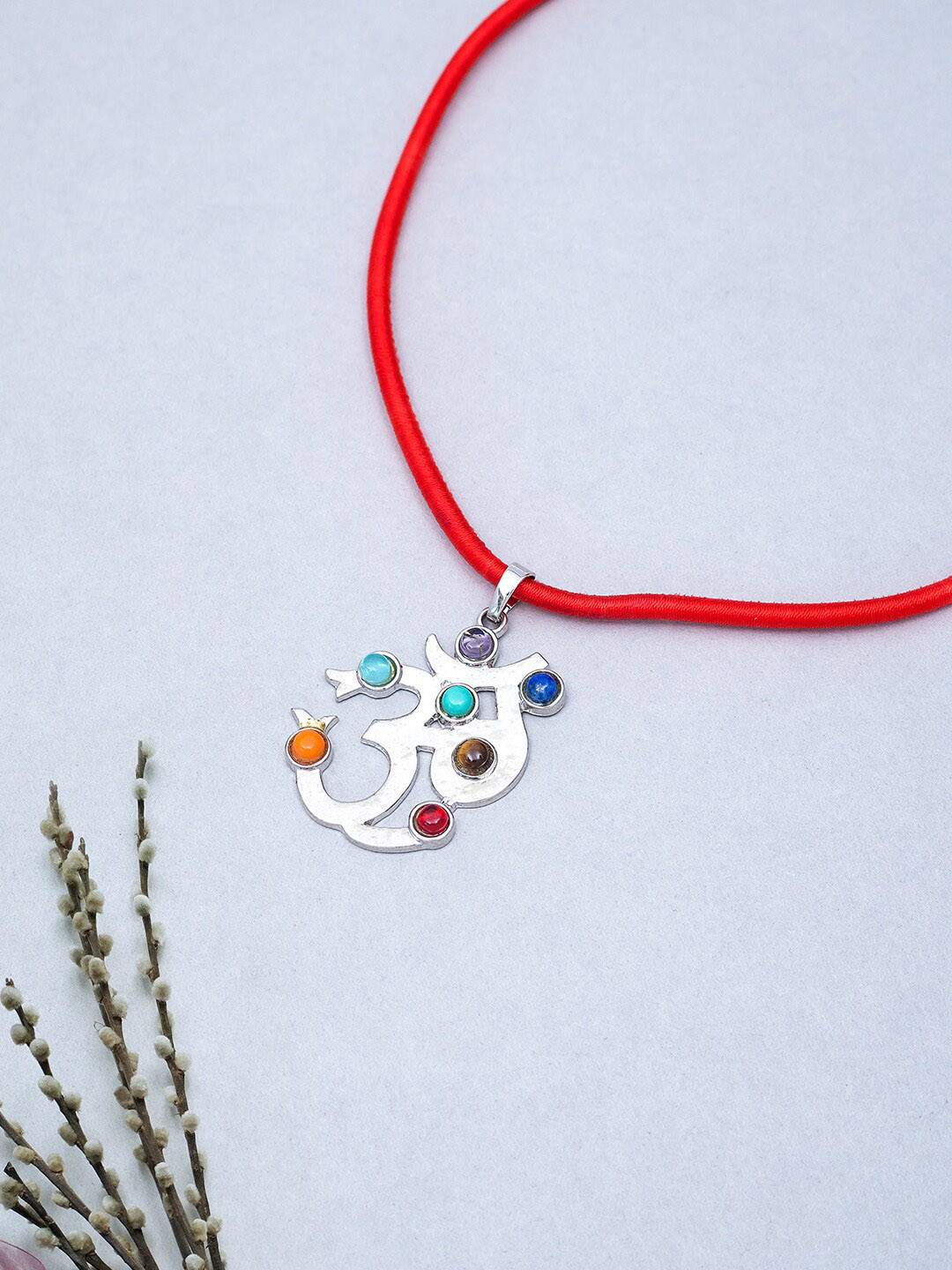 Golden Peacock Silver-Toned Blue & Red Stone-Studded Om Shaped Pendant with Nylon Cord