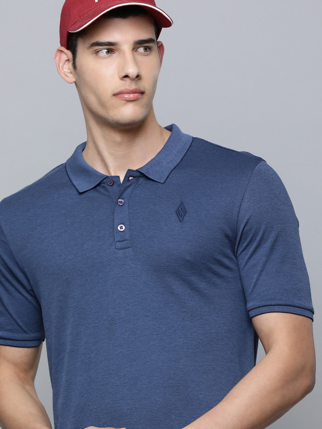 Skechers Men Blue Solid Polo Collar Casual T-shirt
