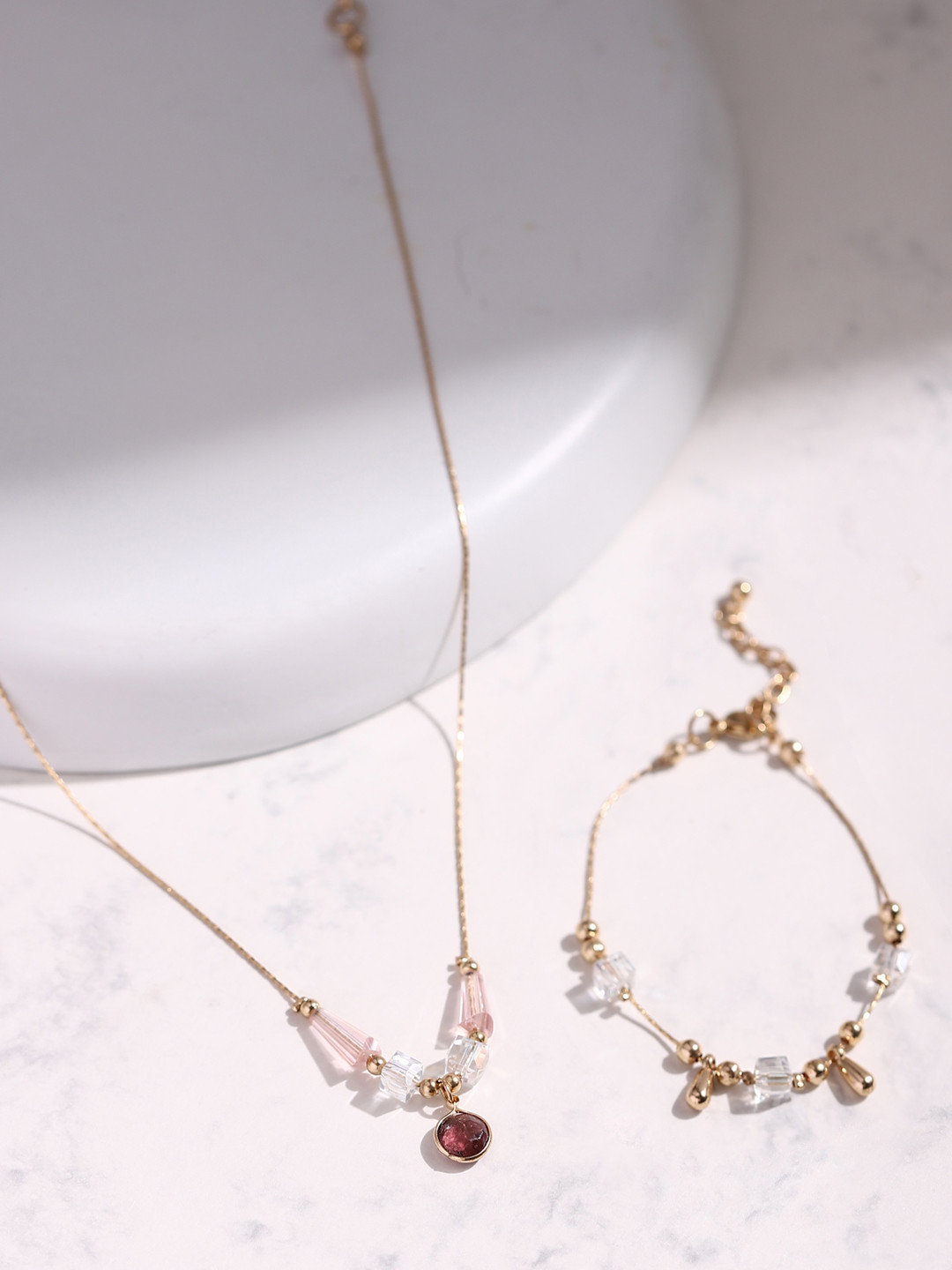 DEEBACO Women Rose Gold-Plated Red & White Stone Studded Jewellery Set