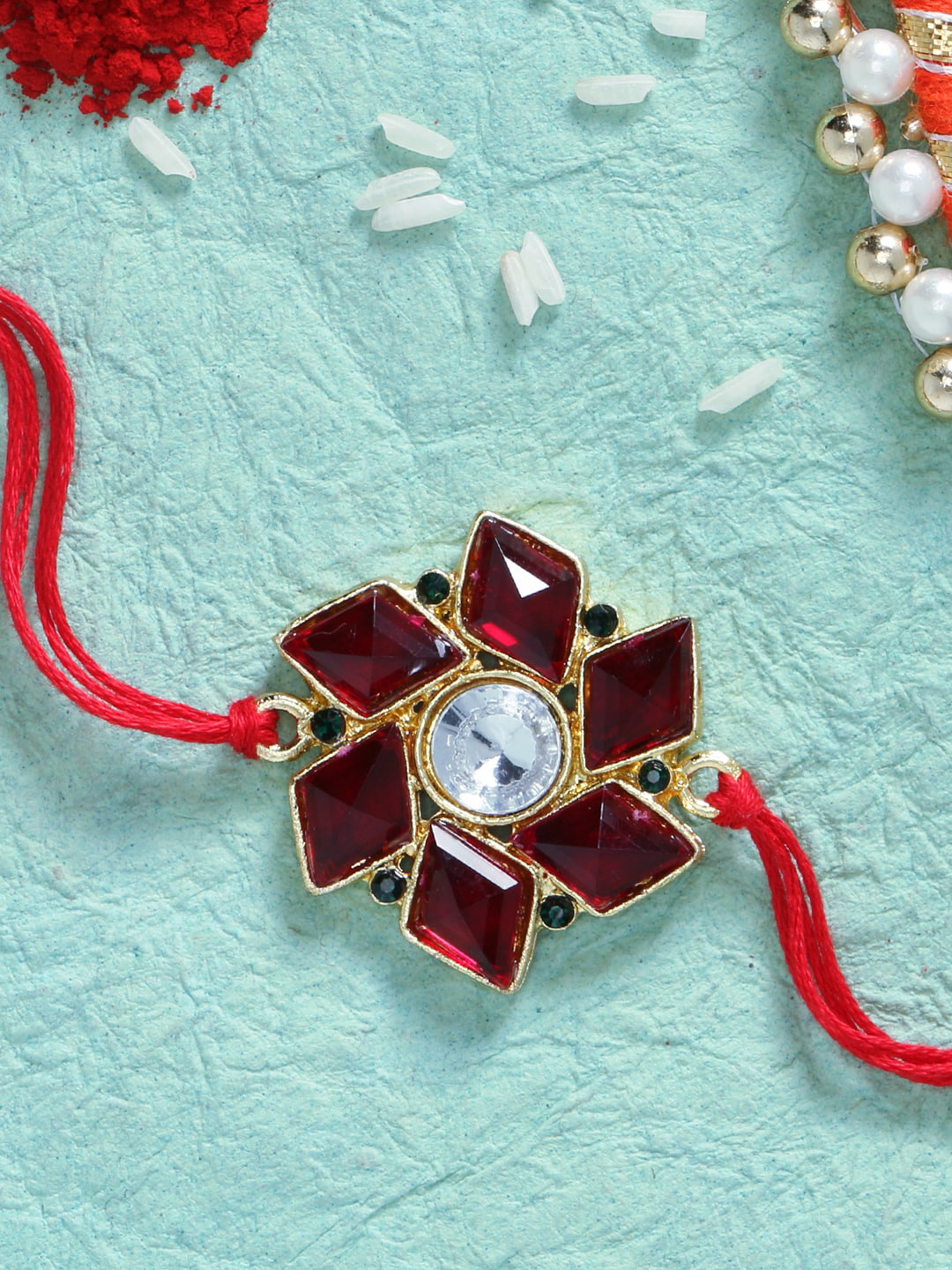 LIVE EVIL Red Gold-Plated Stone Studded Rakhi