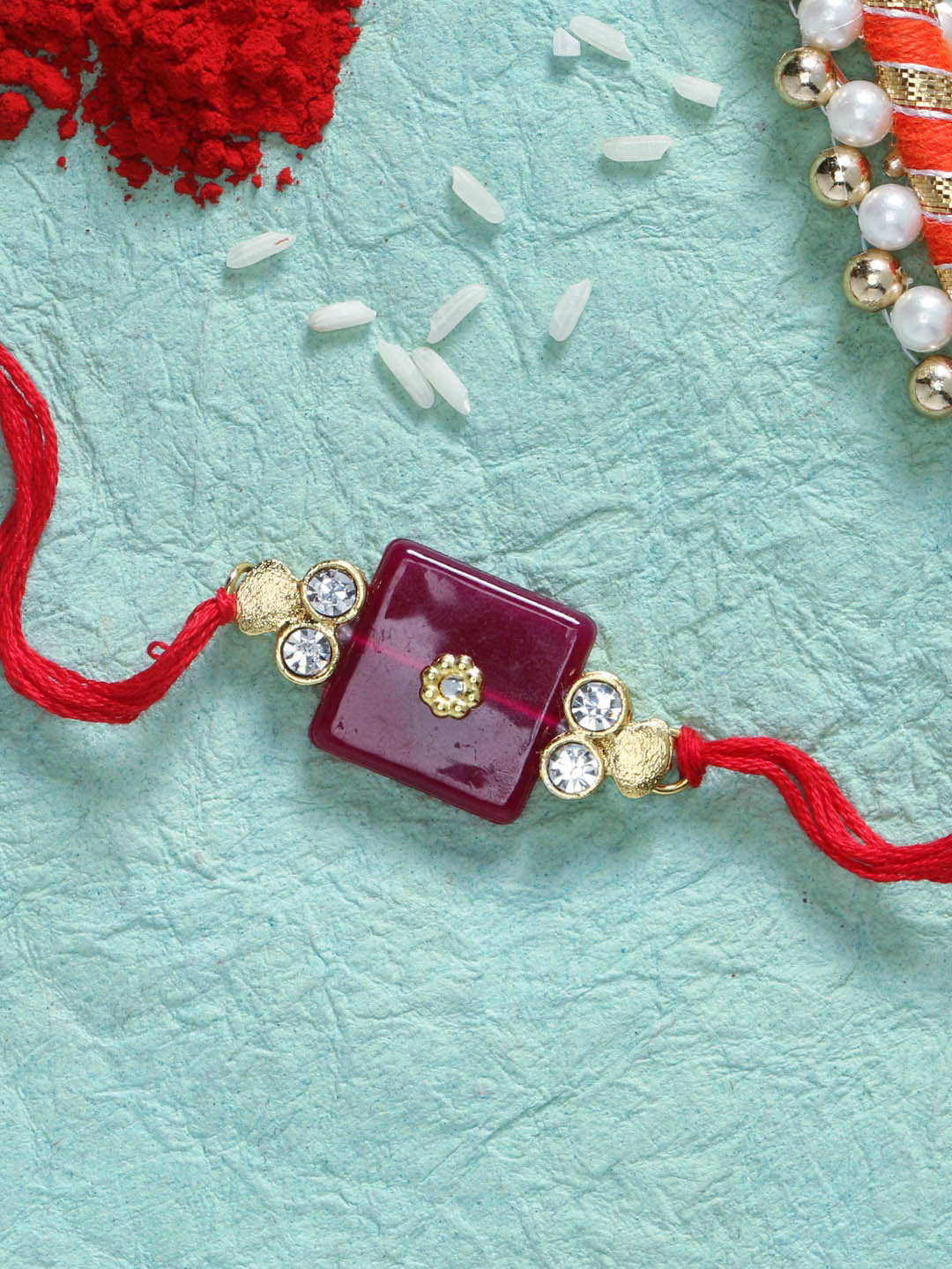 LIVE EVIL Red Gold-plated Stone Work Rakhi & Greeting Card