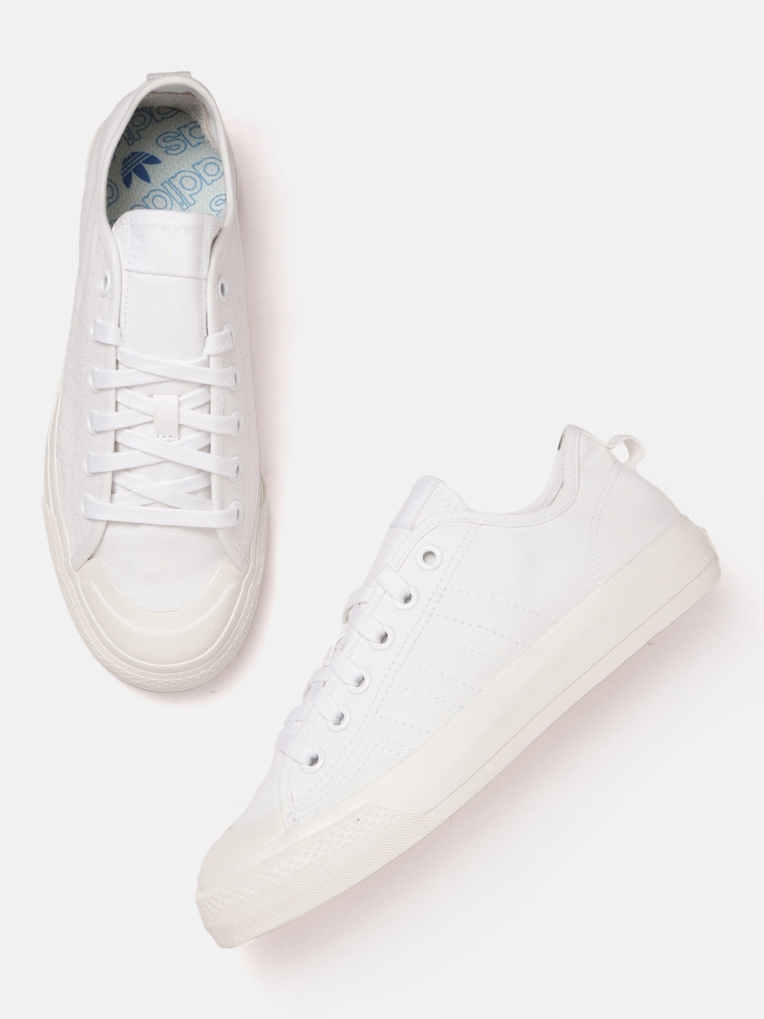 Adidas originals nizza outlet canvas trainers in white