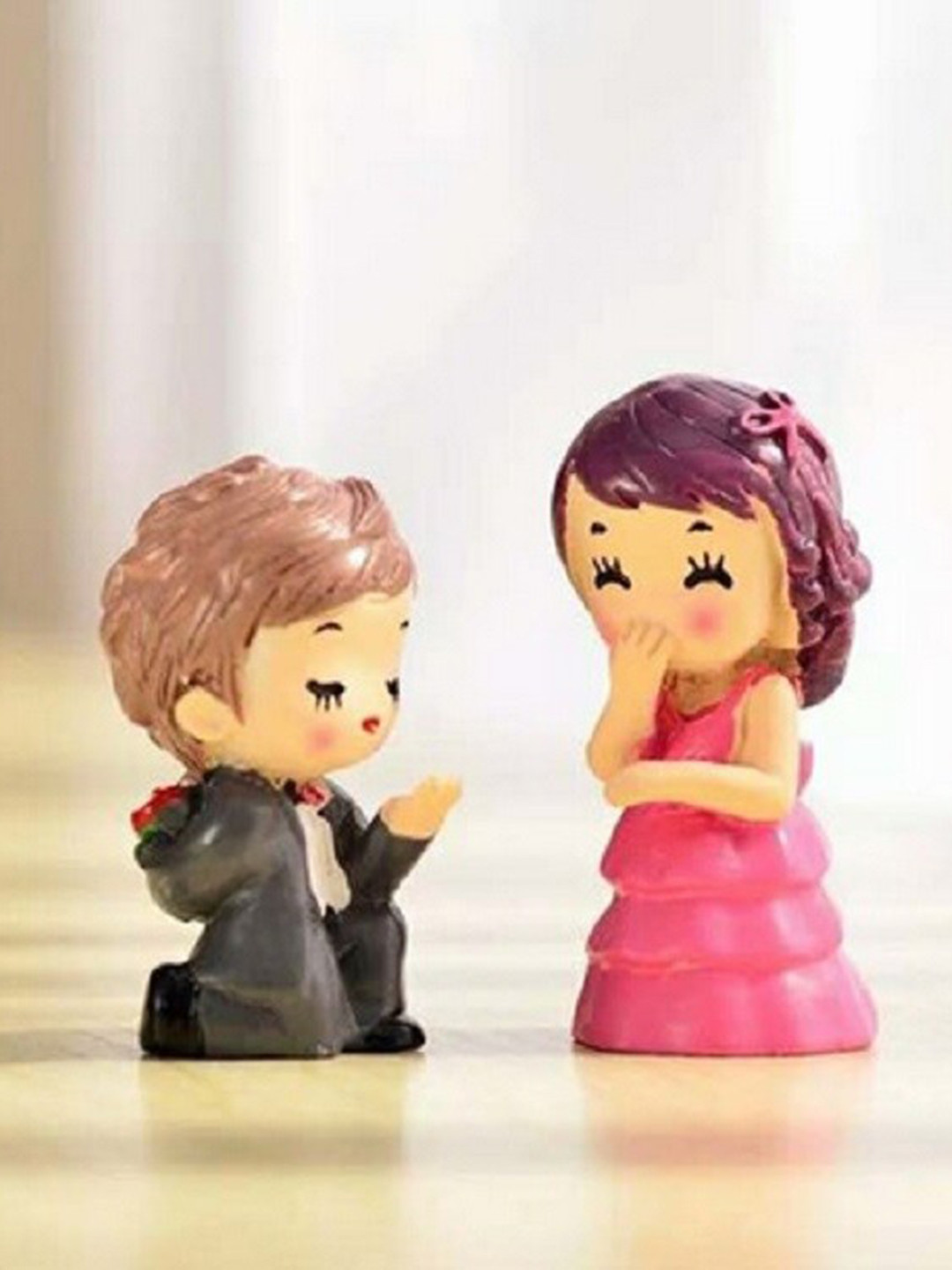 CHOCOZONE Proposing Guy Multicoloured Polyresin Glossy Living Room Set of 2 Small Showpieces - 2.3 Inches