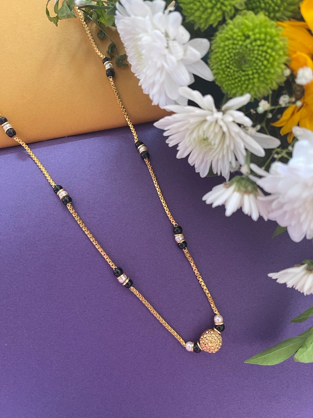 Digital Dress Room Women Gold Plated White & Black Stone Studded & Beaded South Indian Style Ball Mangalsutra