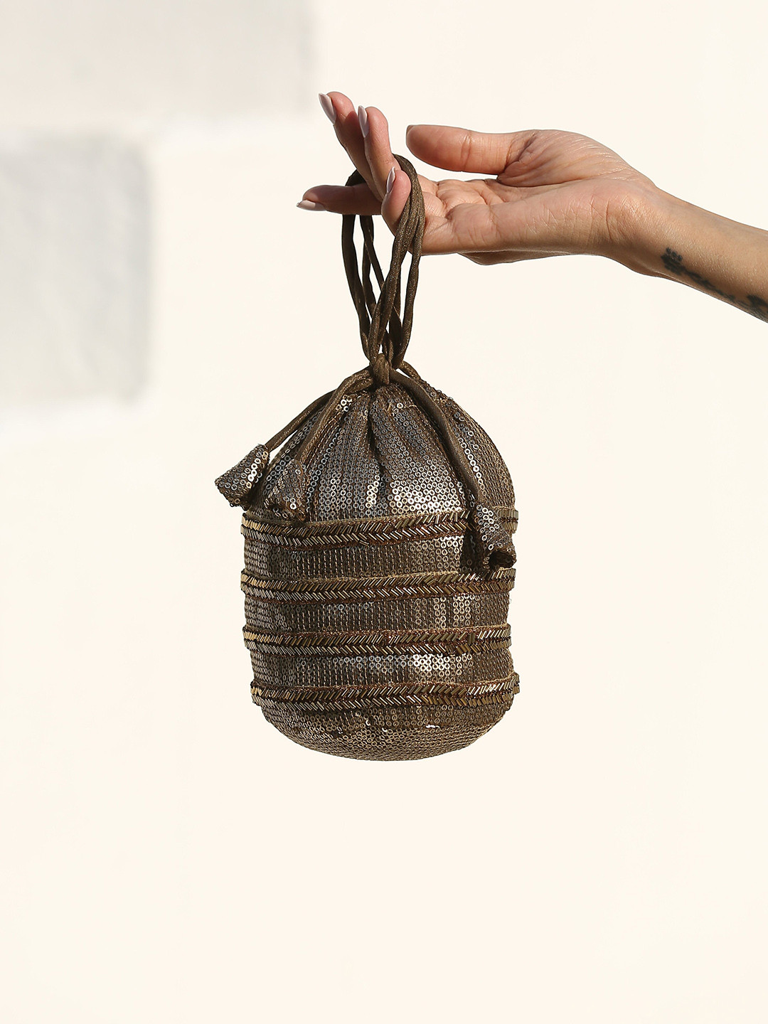 Swtantra Bronze-Toned Embellished Potli Clutch