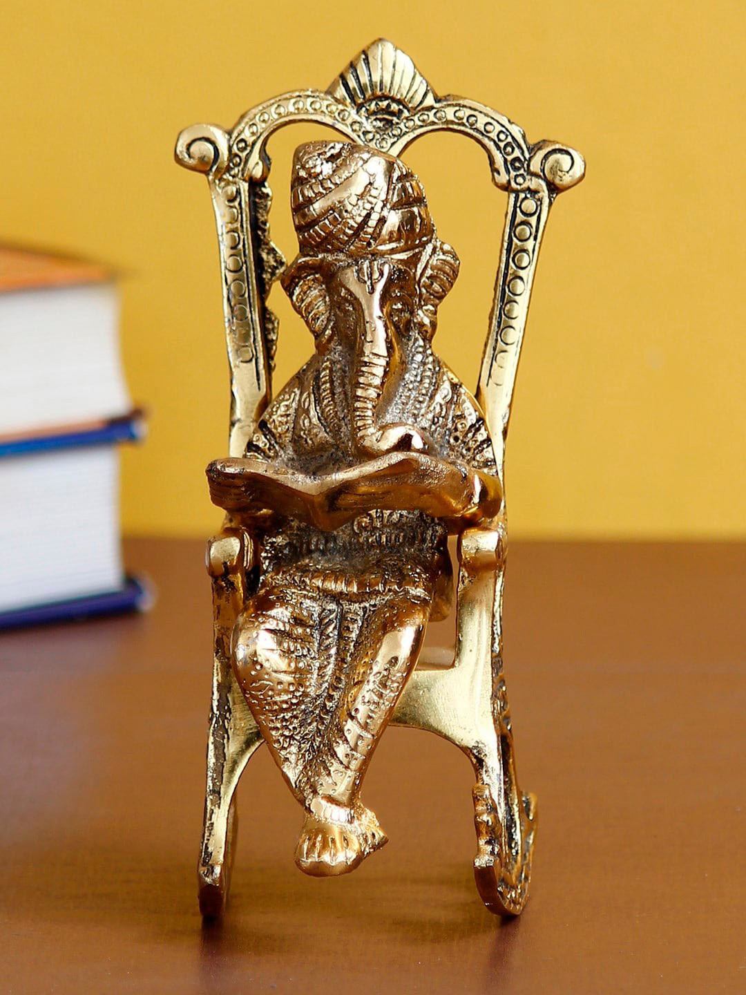 eCraftIndia Lord Ganesha on Rocking Chair Gold Metal Metallic Living Room Small Showpiece - 6.7 Inches