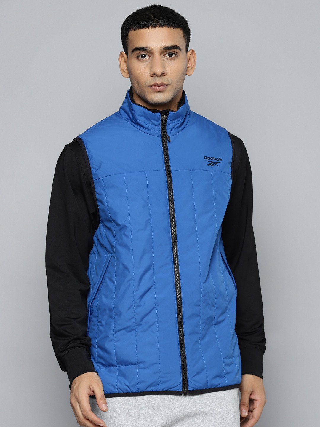 Reebok Men Blue Solid Outdoor Sporty Jacket