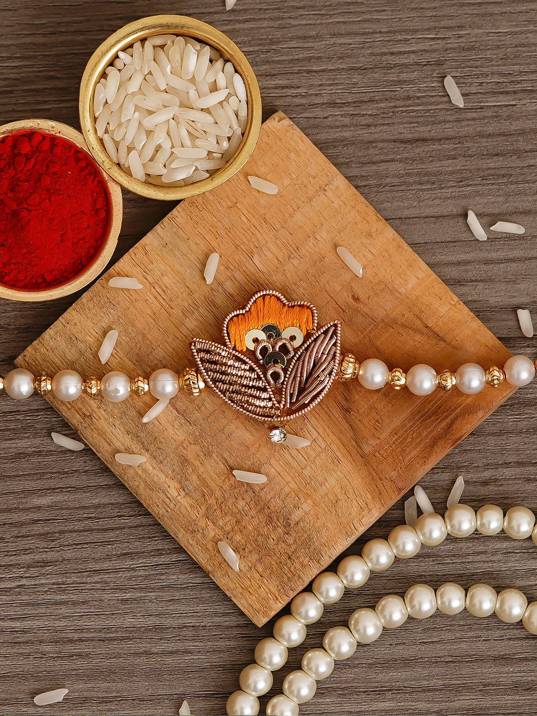 eCraftIndia Orange Designer Pearl & Leaf Rakhi with Roli Chawal