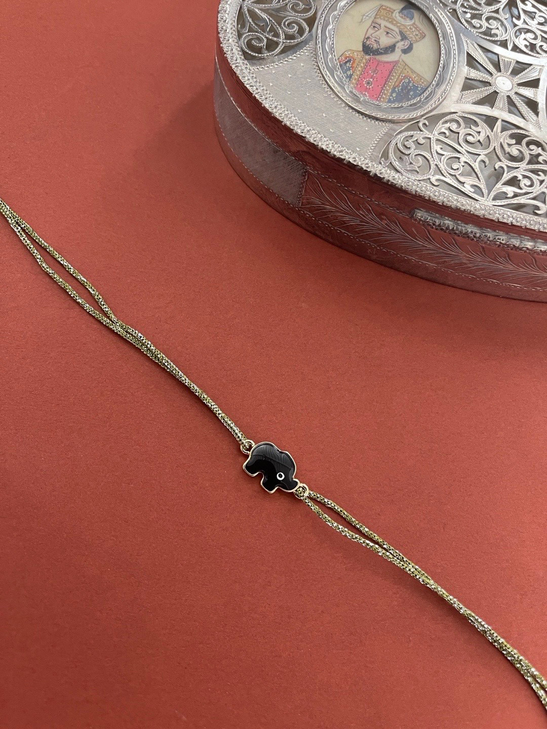 Digital Dress Room Men Black Evil-Eye designed Green Thread Rakhi