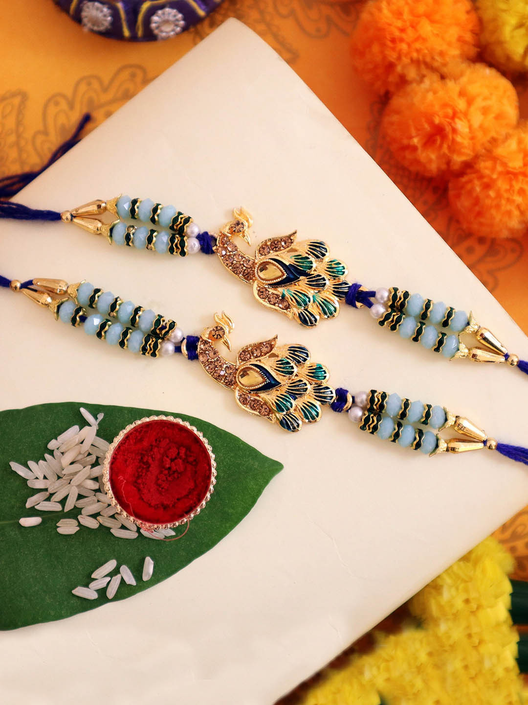 TIED RIBBONS Set of 2 Peacock Rakhi with Roli Chawal Gift Set