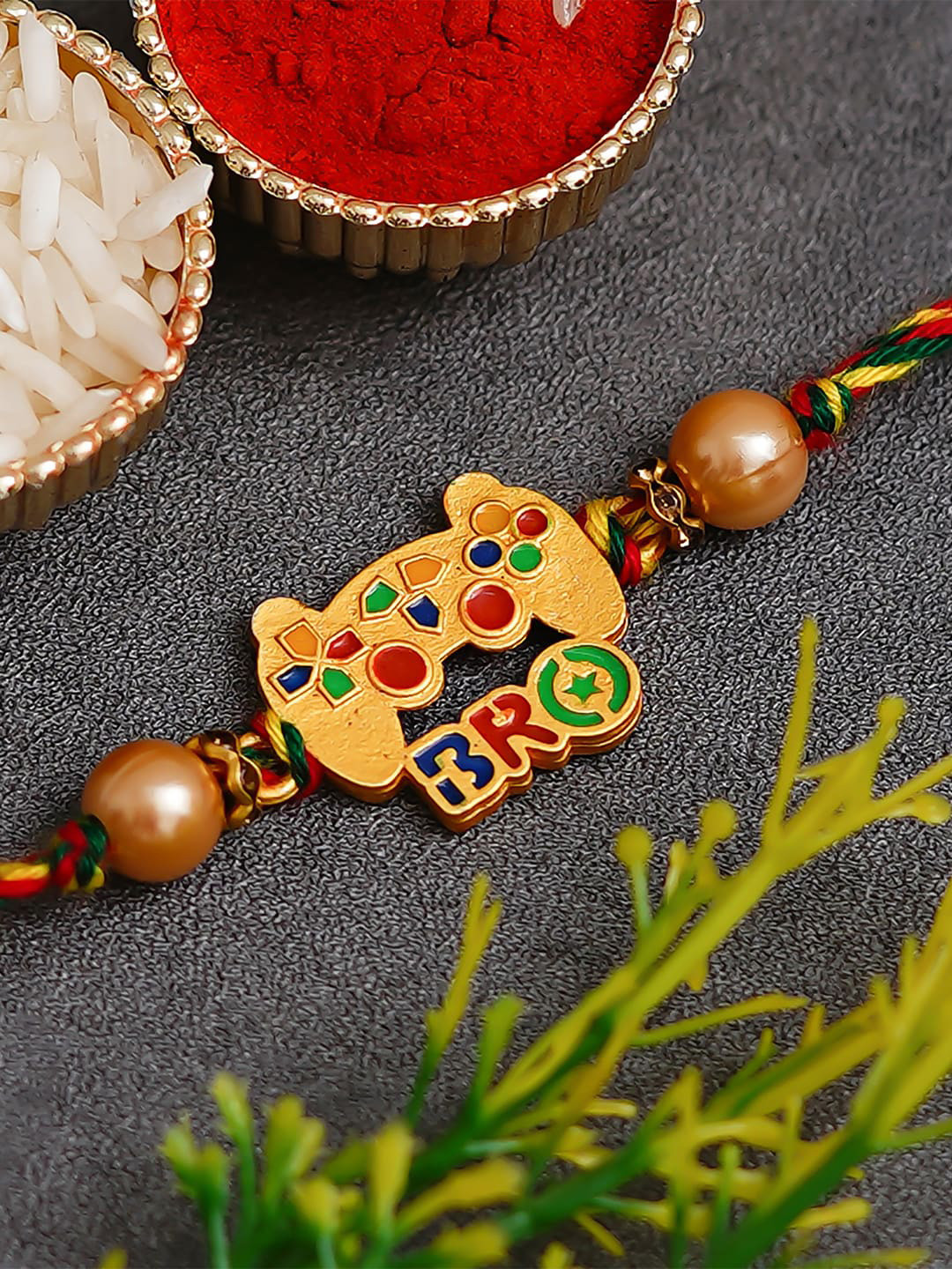 eCraftIndia Gold Toned Designer Bro Rakhi and Roli Chawal Pack