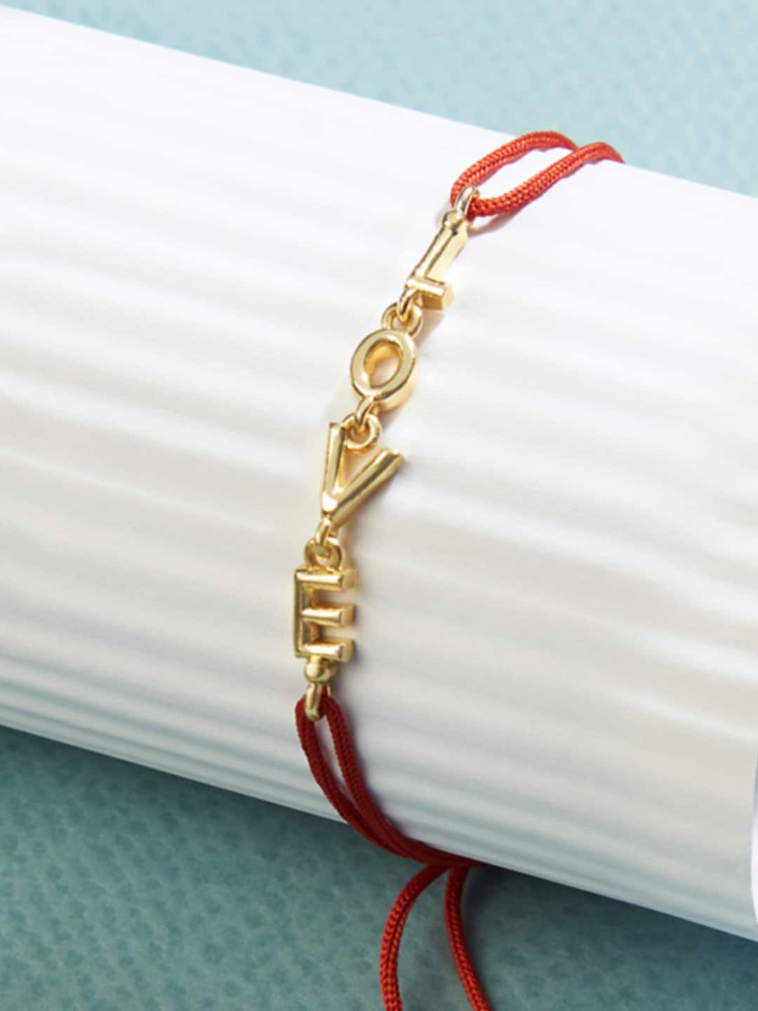 MINUTIAE Men Gold-Toned Designed Inter Locked Red Threaded Rakhi