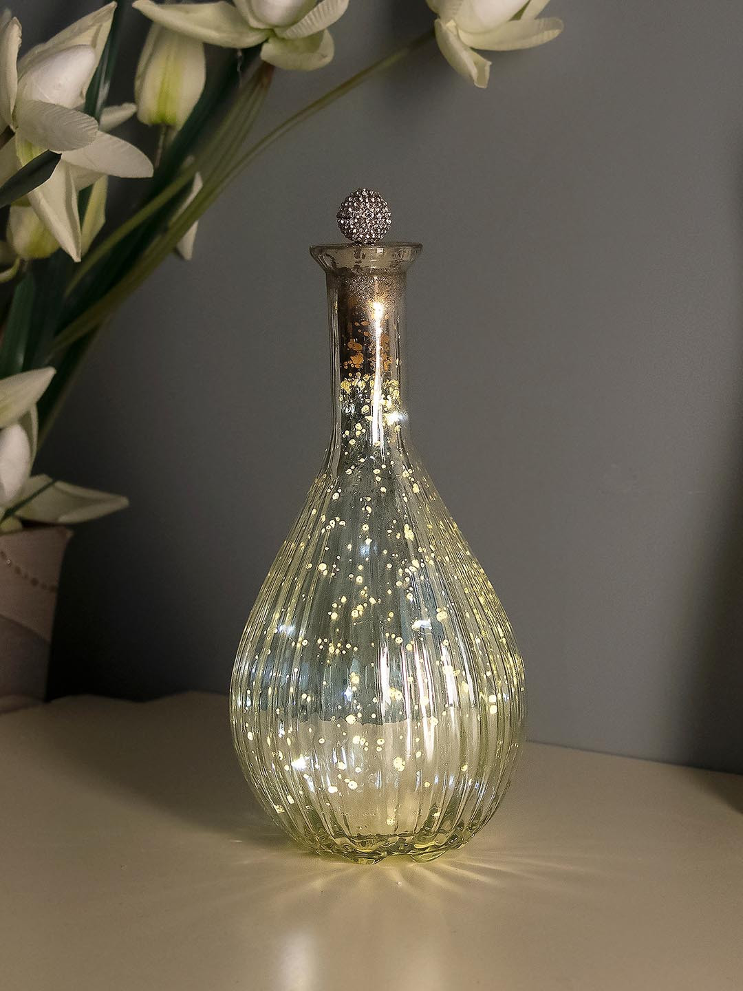 Homesake Mercury Silver Ovoid Bottle Copper Star String Lights