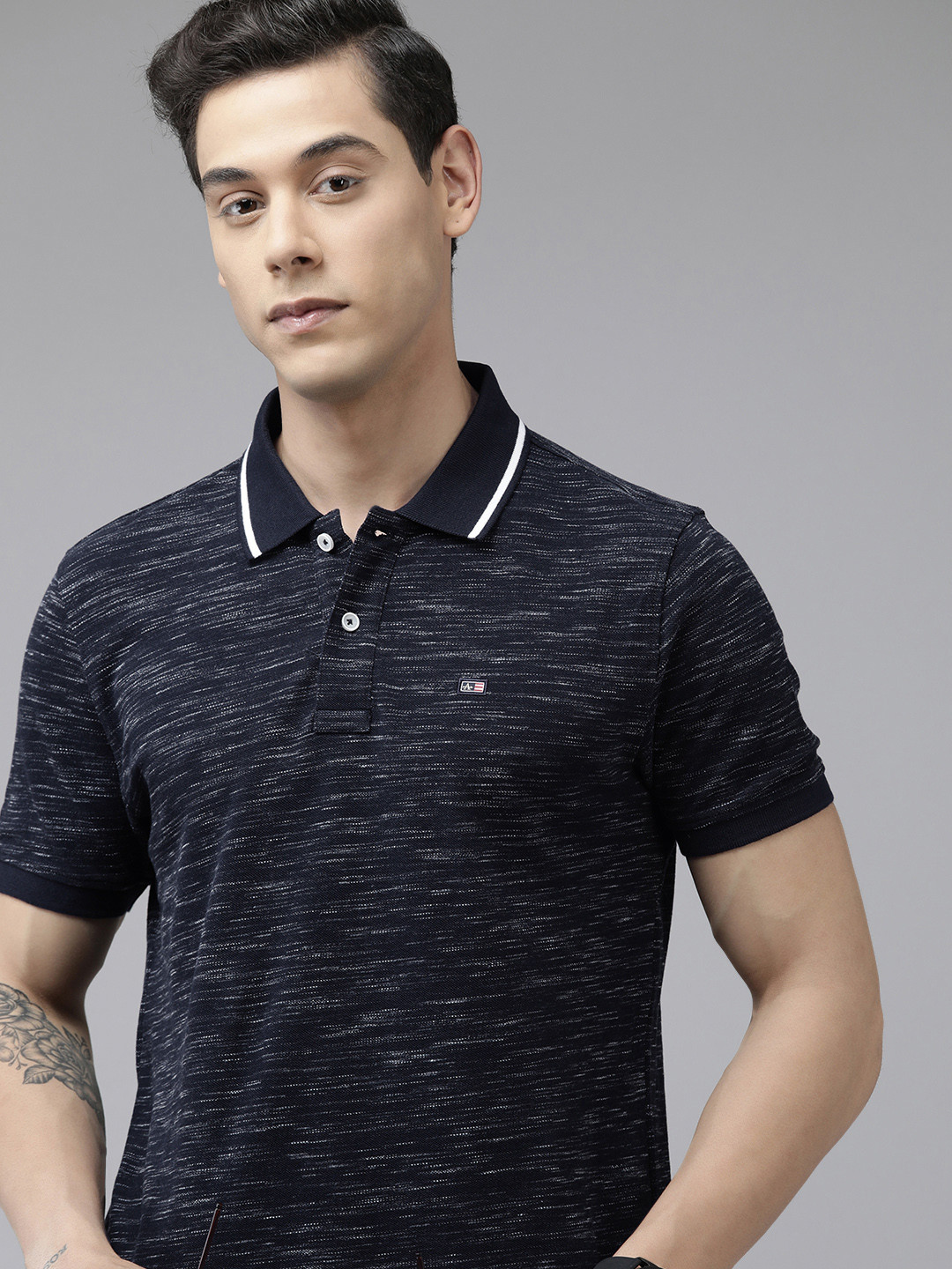 Arrow Men Navy Blue & White Self Design Polo Collar Brand Logo Applique T-shirt