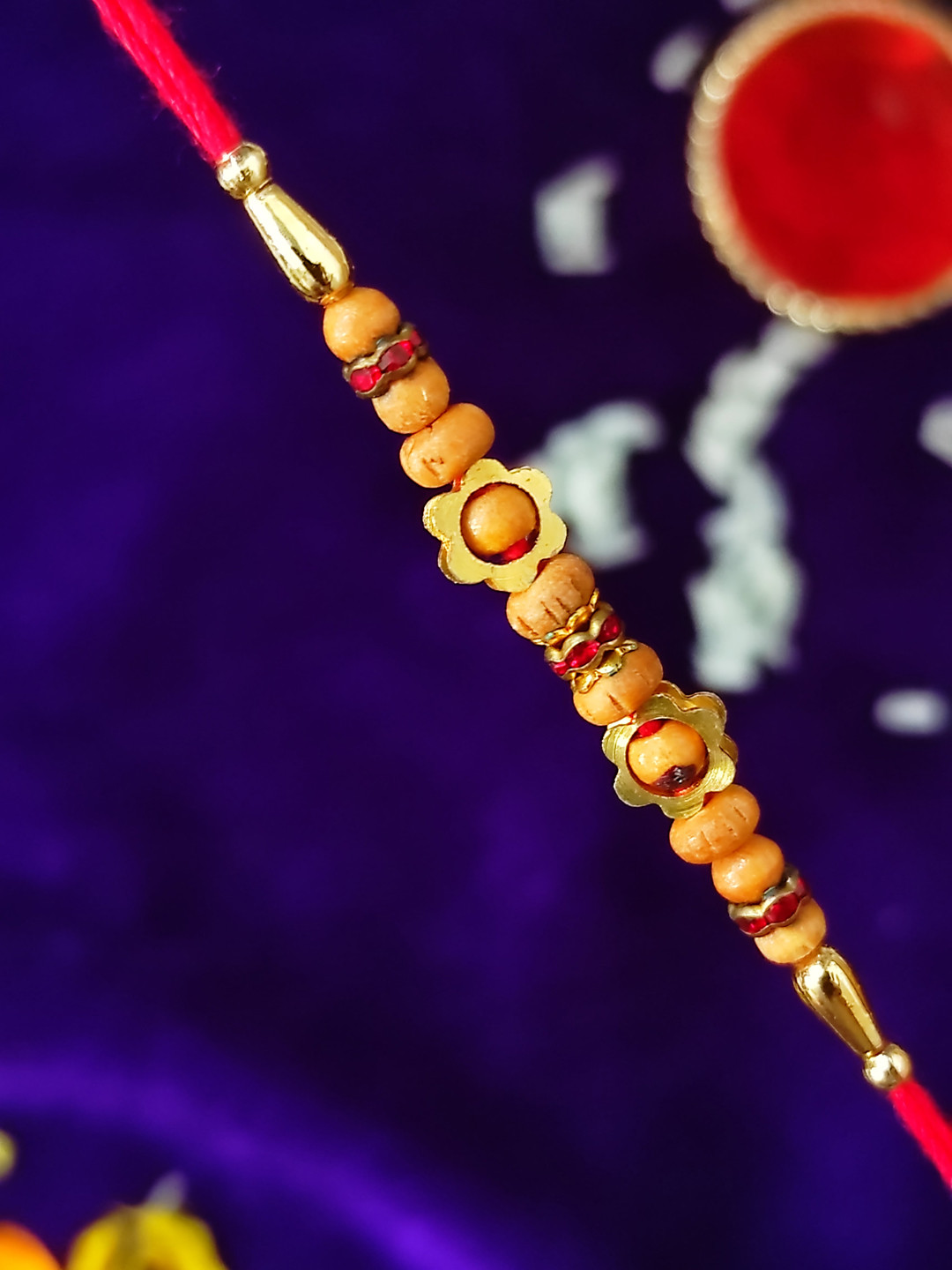 CRAYTON Men Gold Toned & Red Sandalwood with Flower Motif Beaded Rakhi