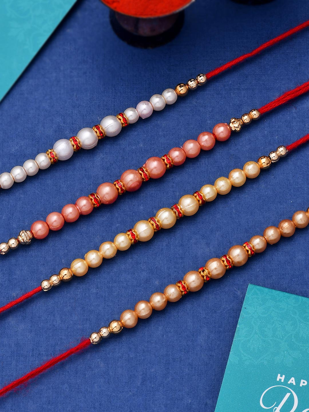 Set of 4 Pearl Beads Embellished Flamboyant Rakhi | Voylla Rakhi