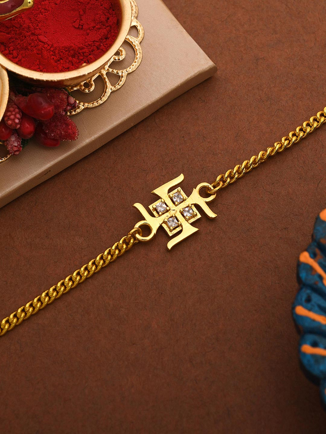 Auspicious Swastik Gold Plated Bracelet Style Rakhi | Voylla Rakhi