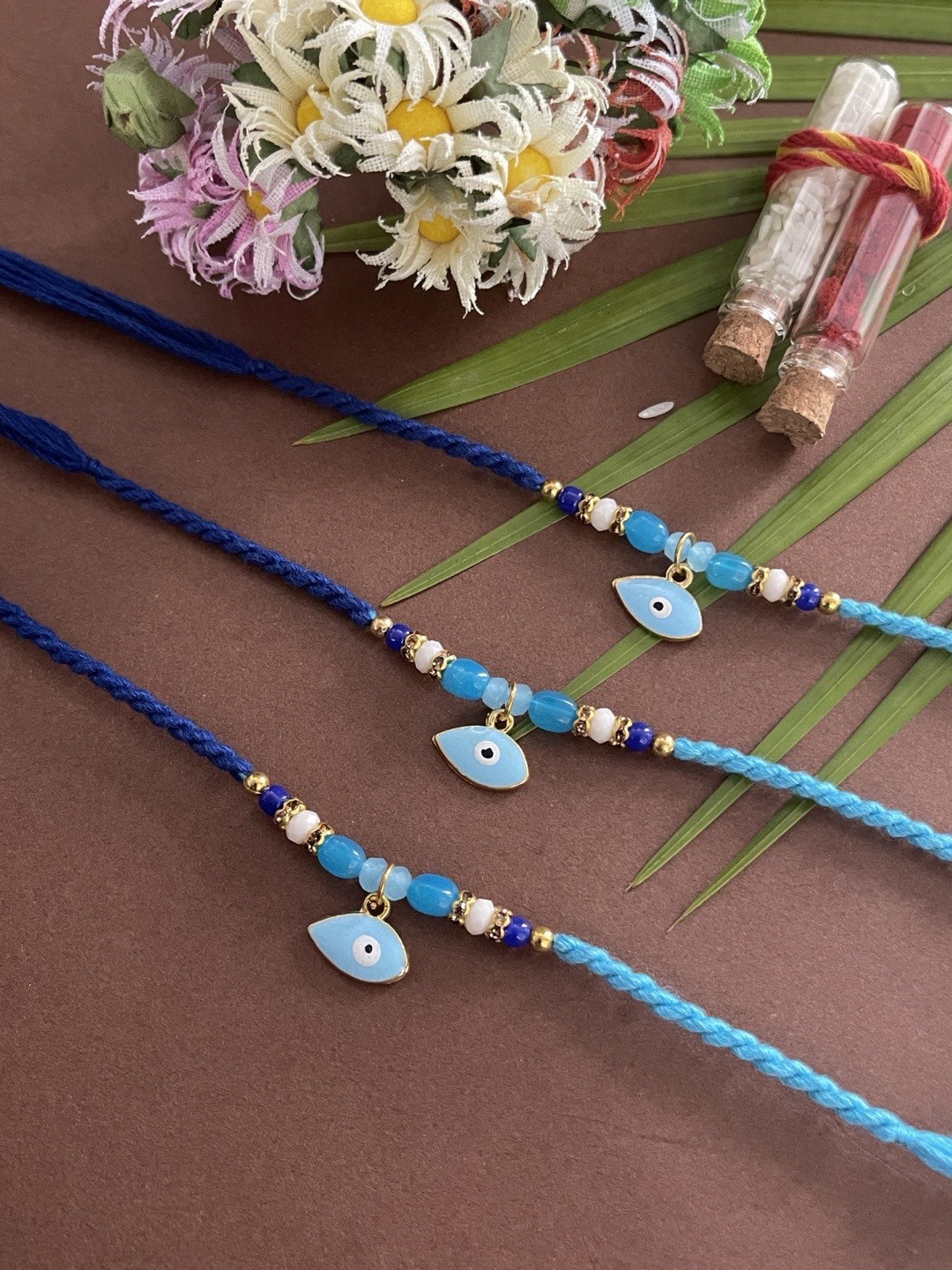 Digital Dress Room Men Set Of 3 Gold-Toned White & Blue Stone-Studded & Beaded Evil Eye Rakhi