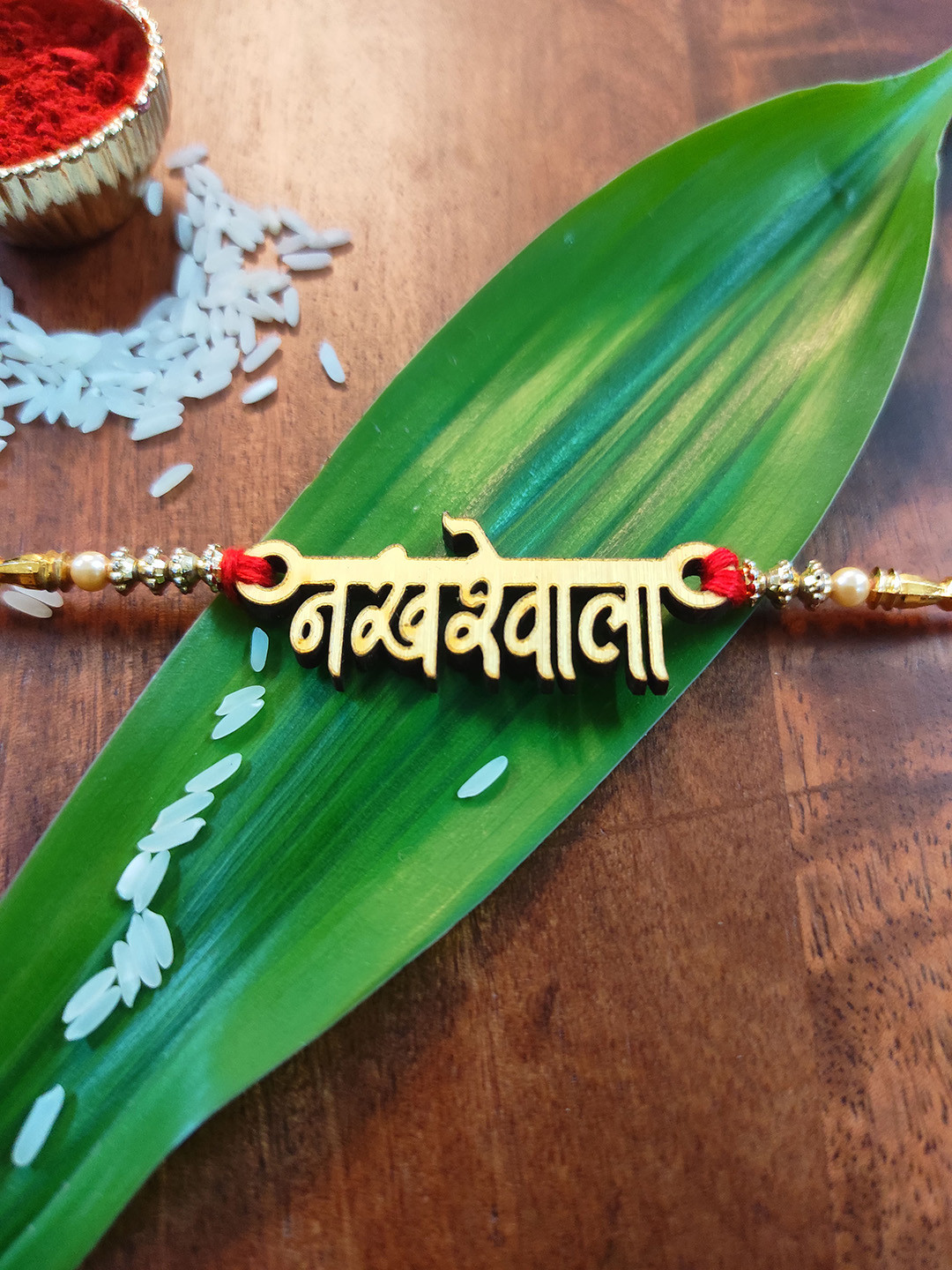 CRAYTON Gold-Toned Rakhi & Red Solid Rakhi