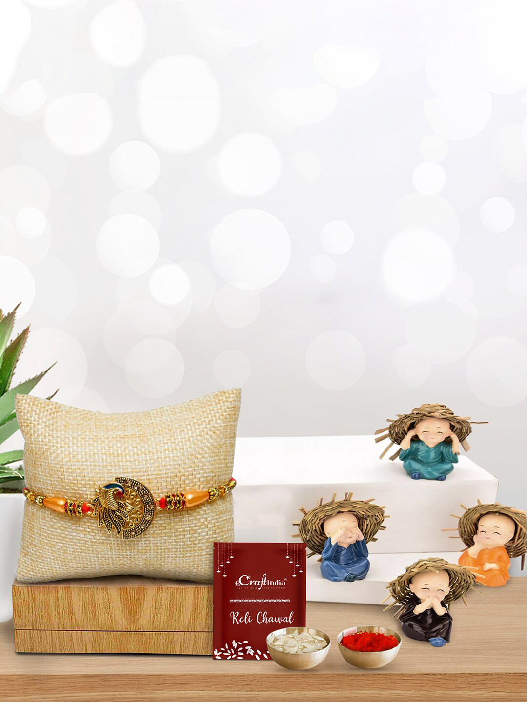 eCraftIndia Orange Rakhi with Set of 4 Monks Showpiece and Roli Chawal Pack,Greeting Card