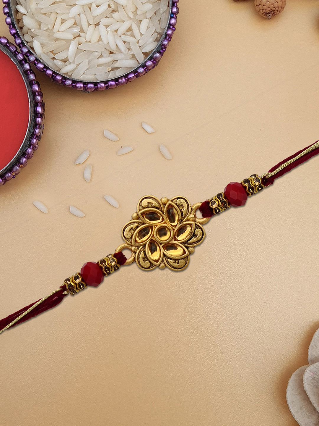 STYBUZZ Gold-Toned & Red Rakhi With Greeting Card and Roli Chawal