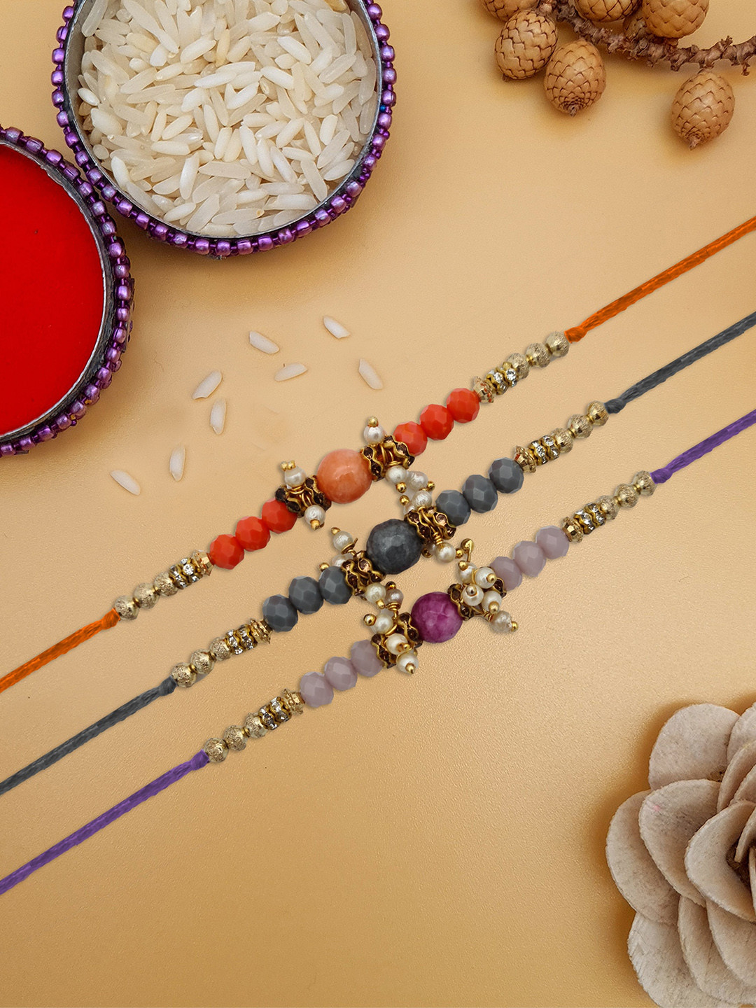 STYBUZZ Set Of 2 Red & Gold-Coloured Beaded Rakhi With Greeting Card and roli chawal