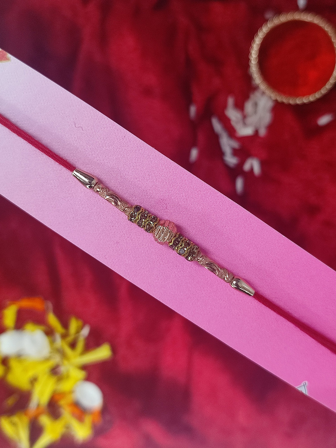 CRAYTON Men Rose Gold-Toned & Red Studs Rakhi