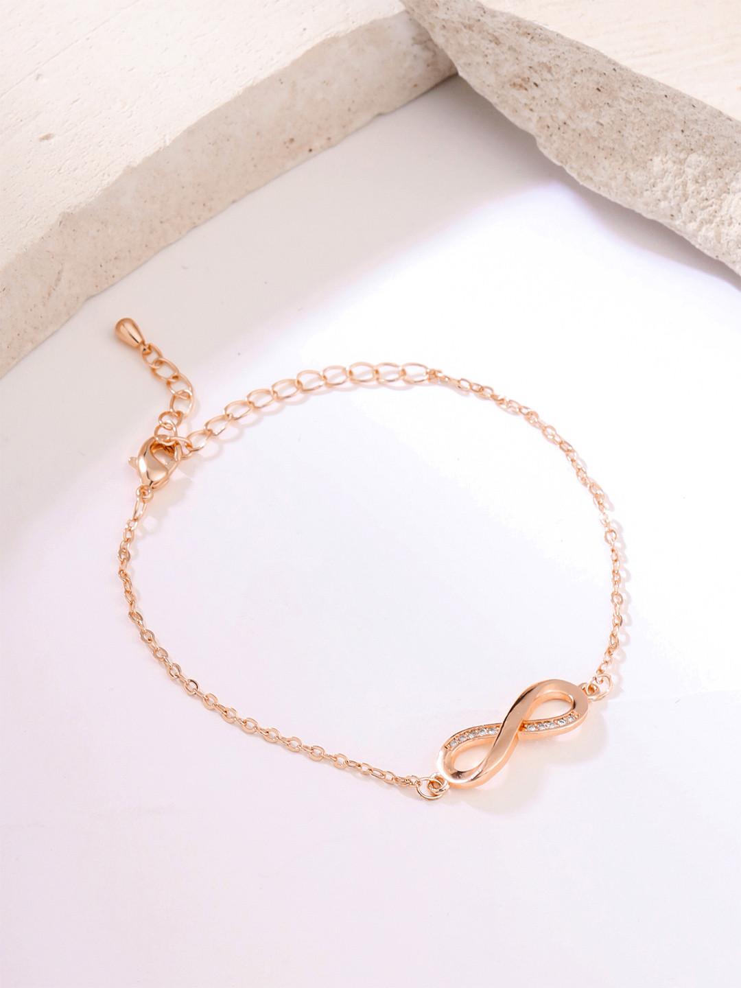 Yellow Chimes Women Gold Toned Infinity Shape Crystal Studded Charming Bracelet