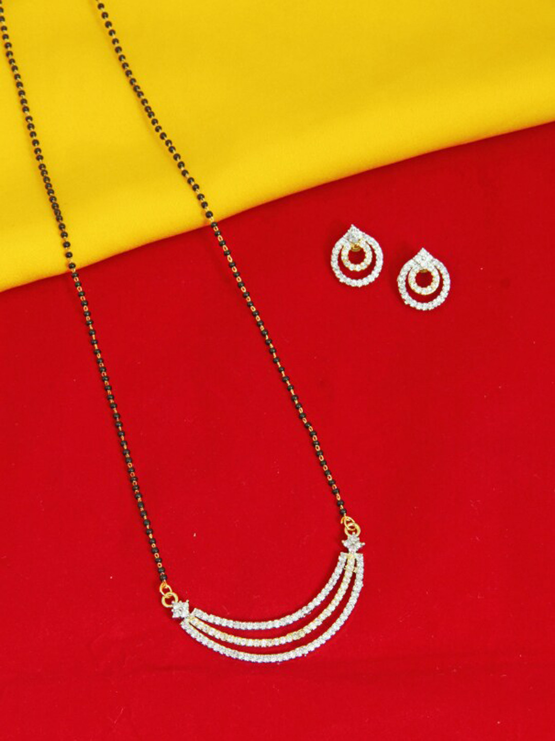 FEMMIBELLA Gold-Plated Black & White Stone Studded & Beaded Half Moon Mangalsutra