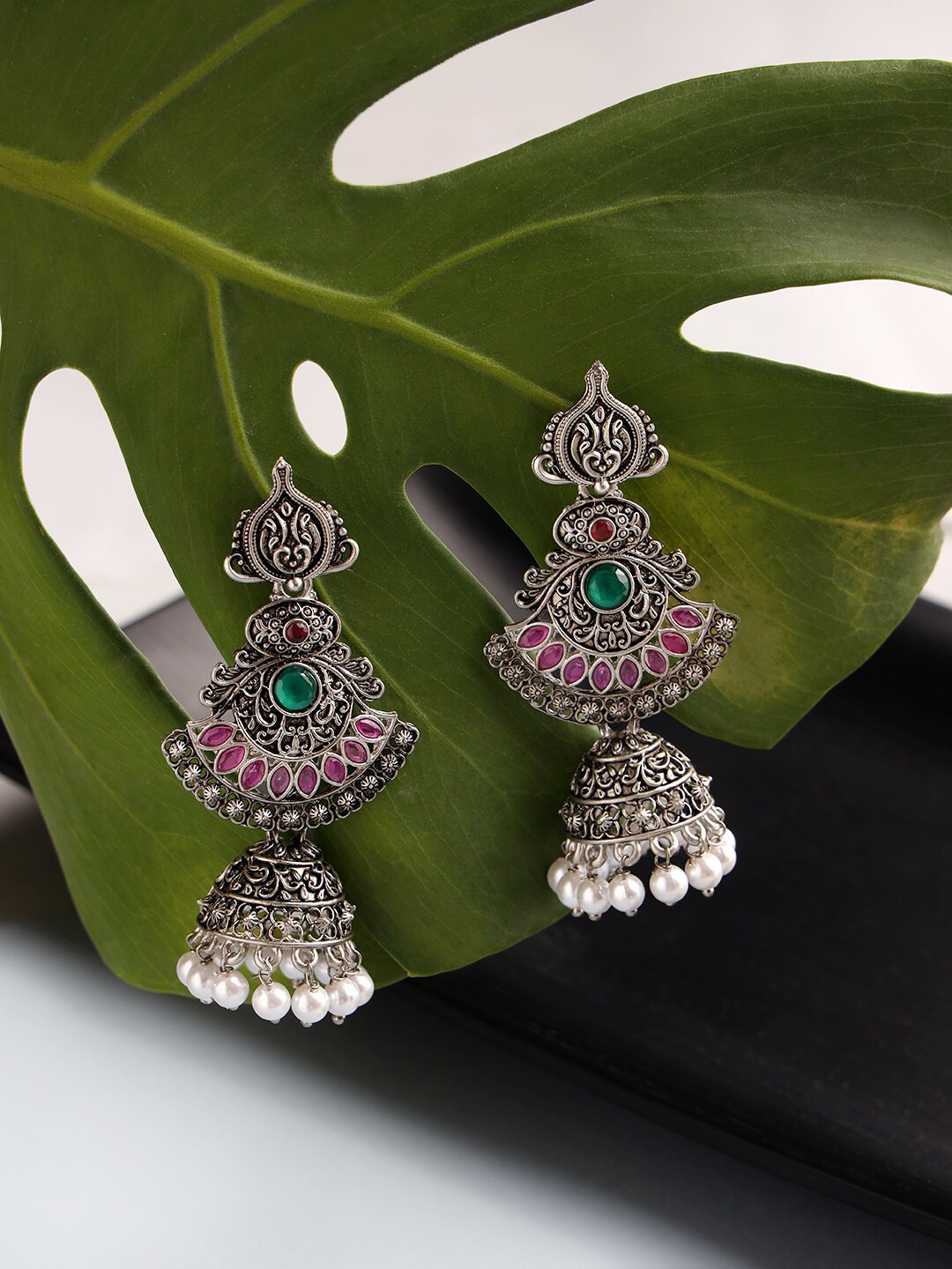 Jazz and Sizzle Silver-Toned Peacock Shaped Jhumkas Earrings
