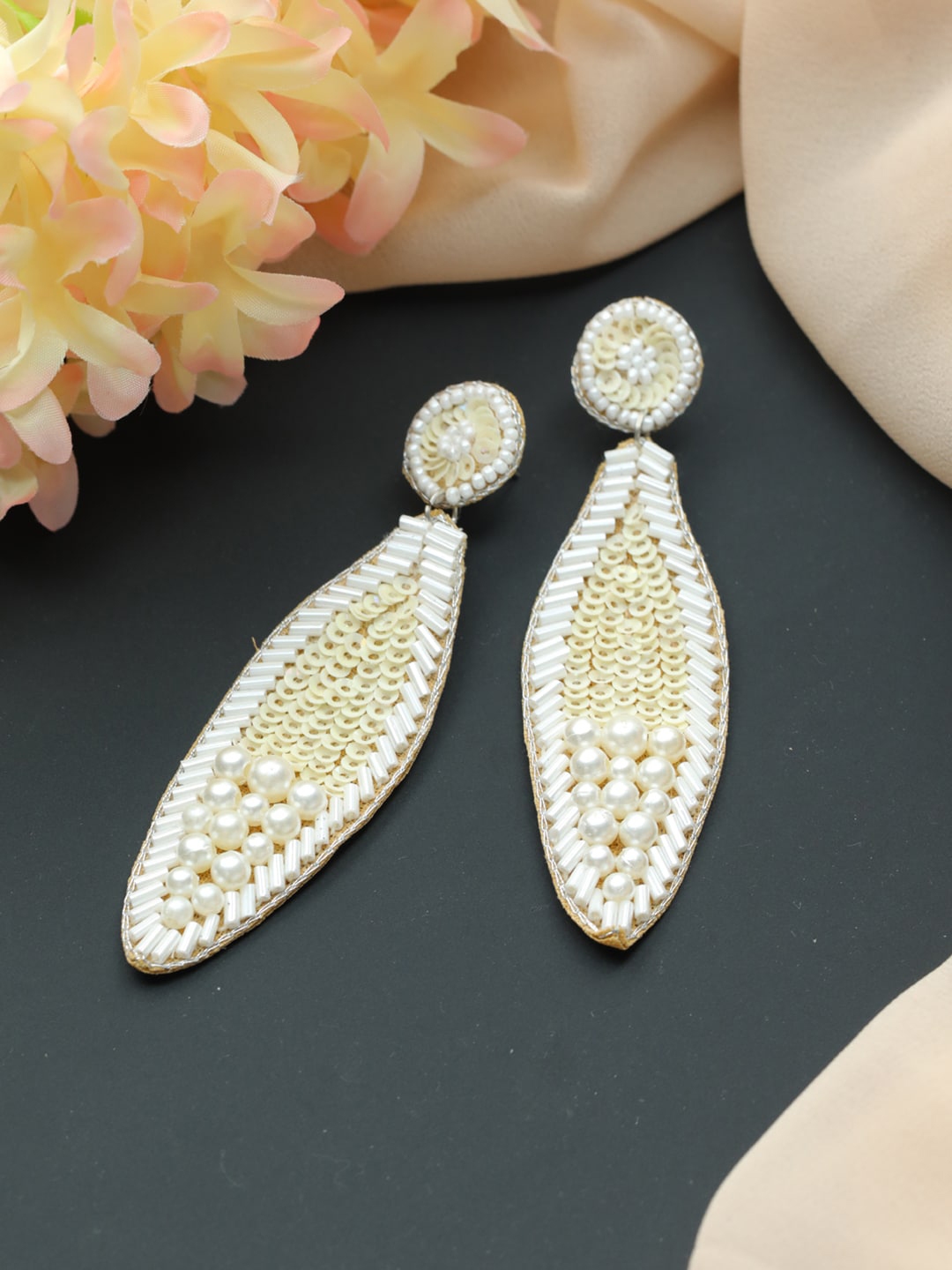 Buy Jazz And Sizzle Off White Feather Shaped Drop Earrings