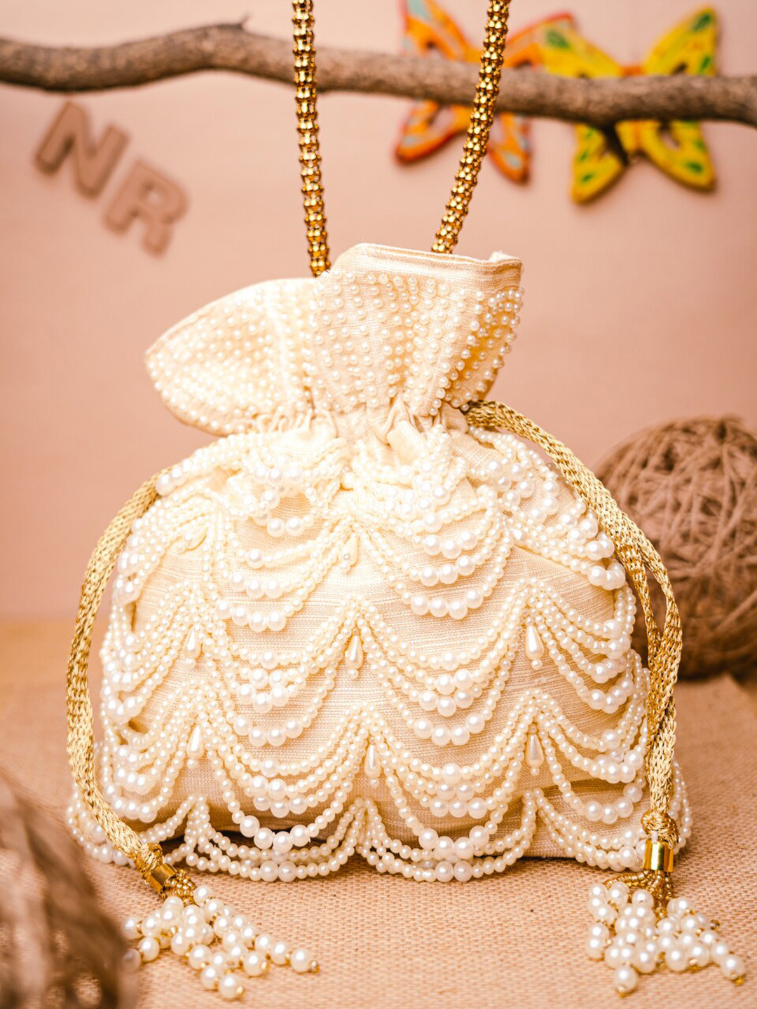 NR By Nidhi Rathi Cream-Coloured & Yellow Embroidered Potli Clutch