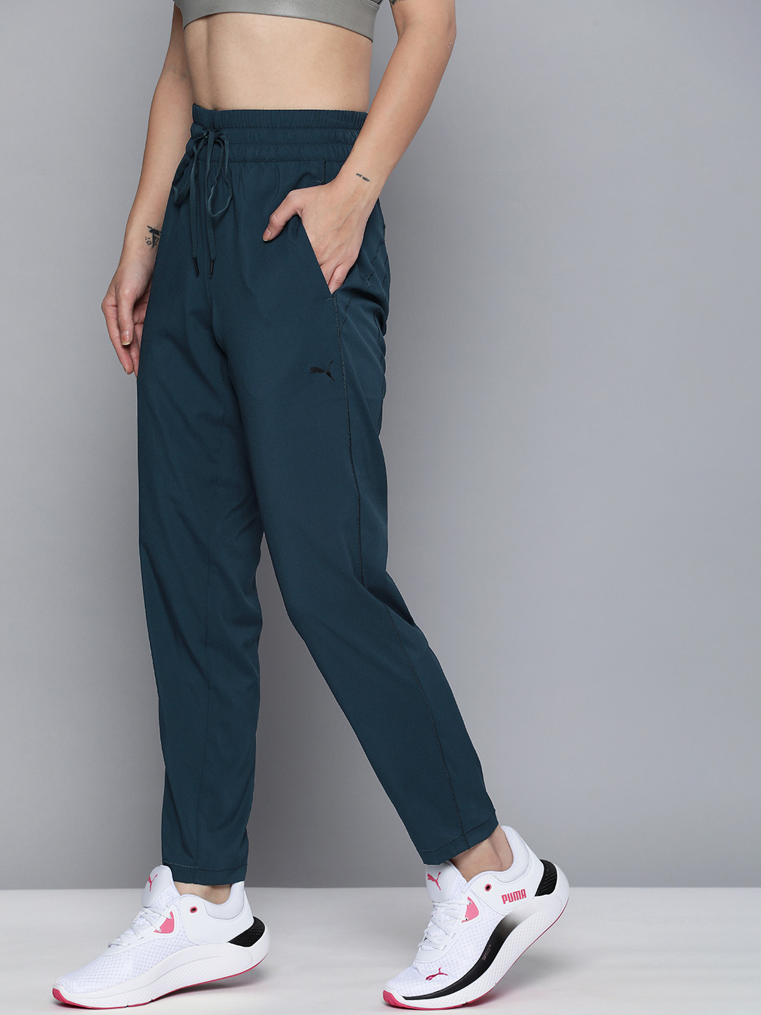 Puma Studio Women Teal Blue Solid Tapered Woven dryCELL Training Sustainable Track Pants