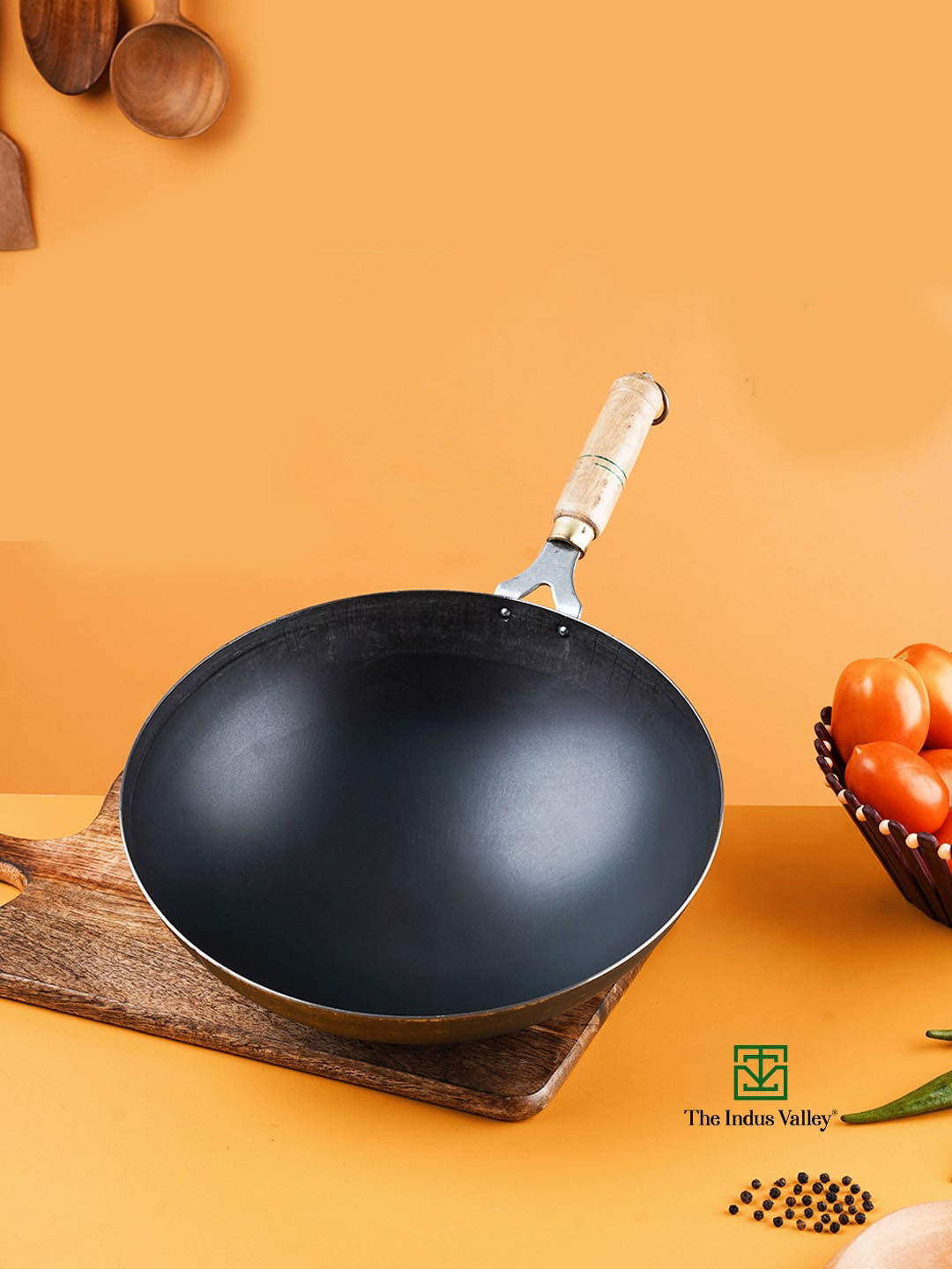 The Indus Valley Black Solid Pre-Seasoned Iron Wok With Wooden Handle