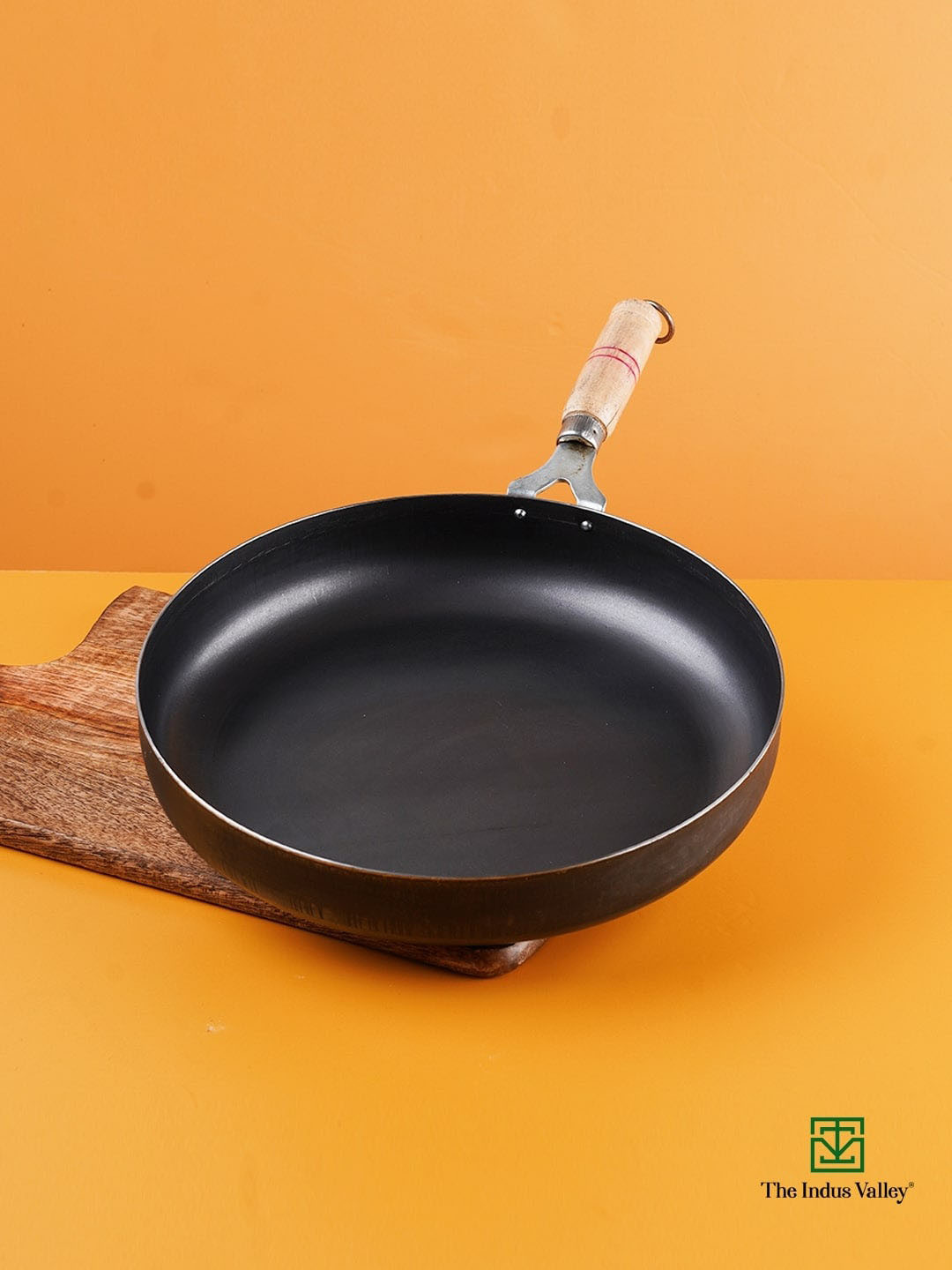 The Indus Valley Black Solid Pre-Seasoned Iron Pan With Wooden Handle 3.4 L