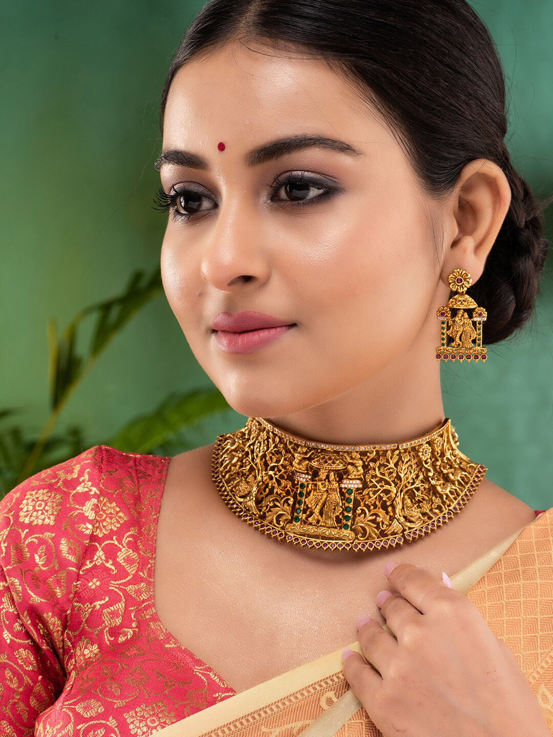 Saraf RS Jewellery Gold-Plated Green AD Studded Radha Krishna Temple Jewellery Set