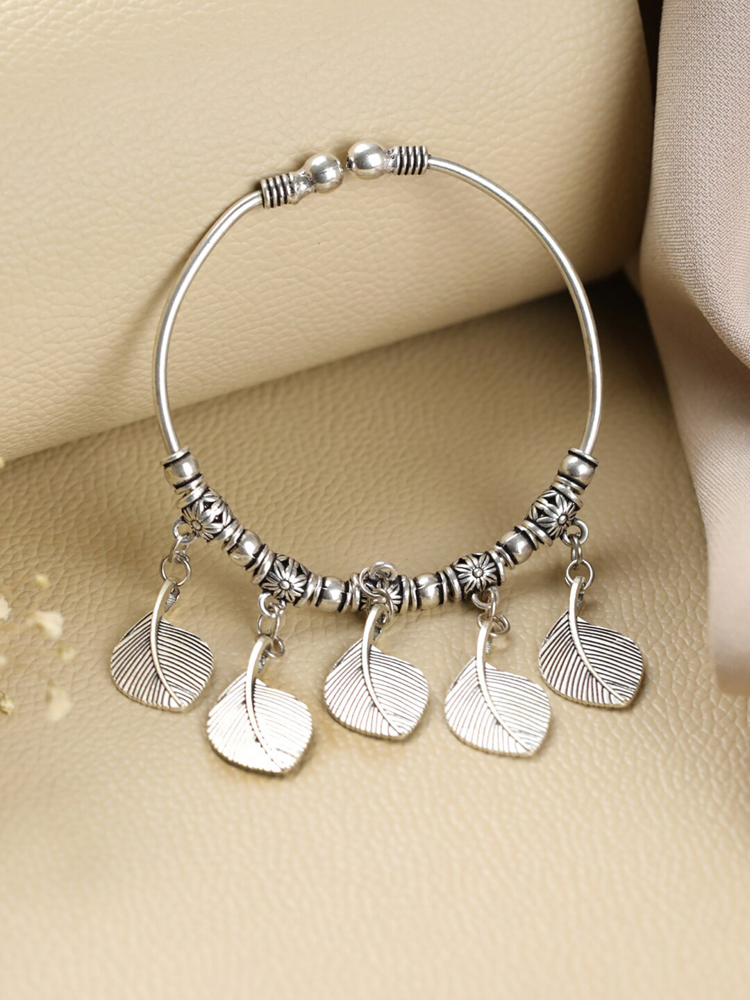 Jazz and Sizzle Women Silver-Toned & Black Brass Handcrafted Silver-Plated Bangle-Style Bracelet