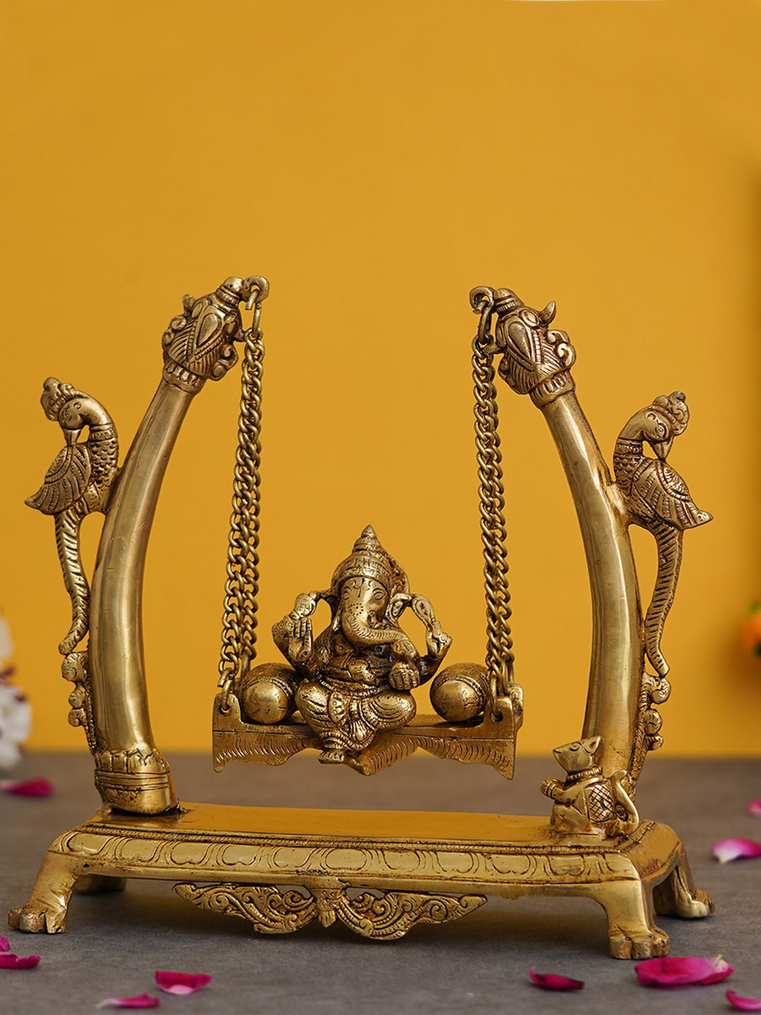 eCraftIndia Lord Ganesha On A Peacock Swing Gold Brass Metallic Prayer Room Hand-Crafted Medium Showpiece - 9.4 Inches